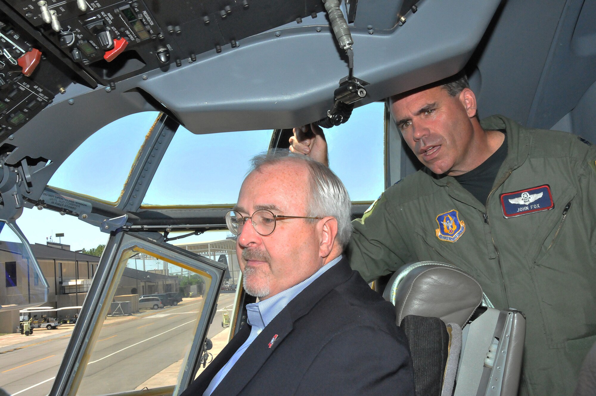 Craig Fugate, the Federal Emergency Management Agency administrator, looks over the control panel of a WC-130J Hercules as Lt. Col. John Fox, a navigator with the 53rd Weather Reconnaissance Squadron Hurricane Hunters at Keesler Air Force Base, Miss., briefs the unit's mission.  Mr. Fugate was at Keesler AFB April 29, 2010, to visit the squadron and discuss hurricane preparedness. (U.S. Air Force photo/Senior Airman Kimberly Erickson)