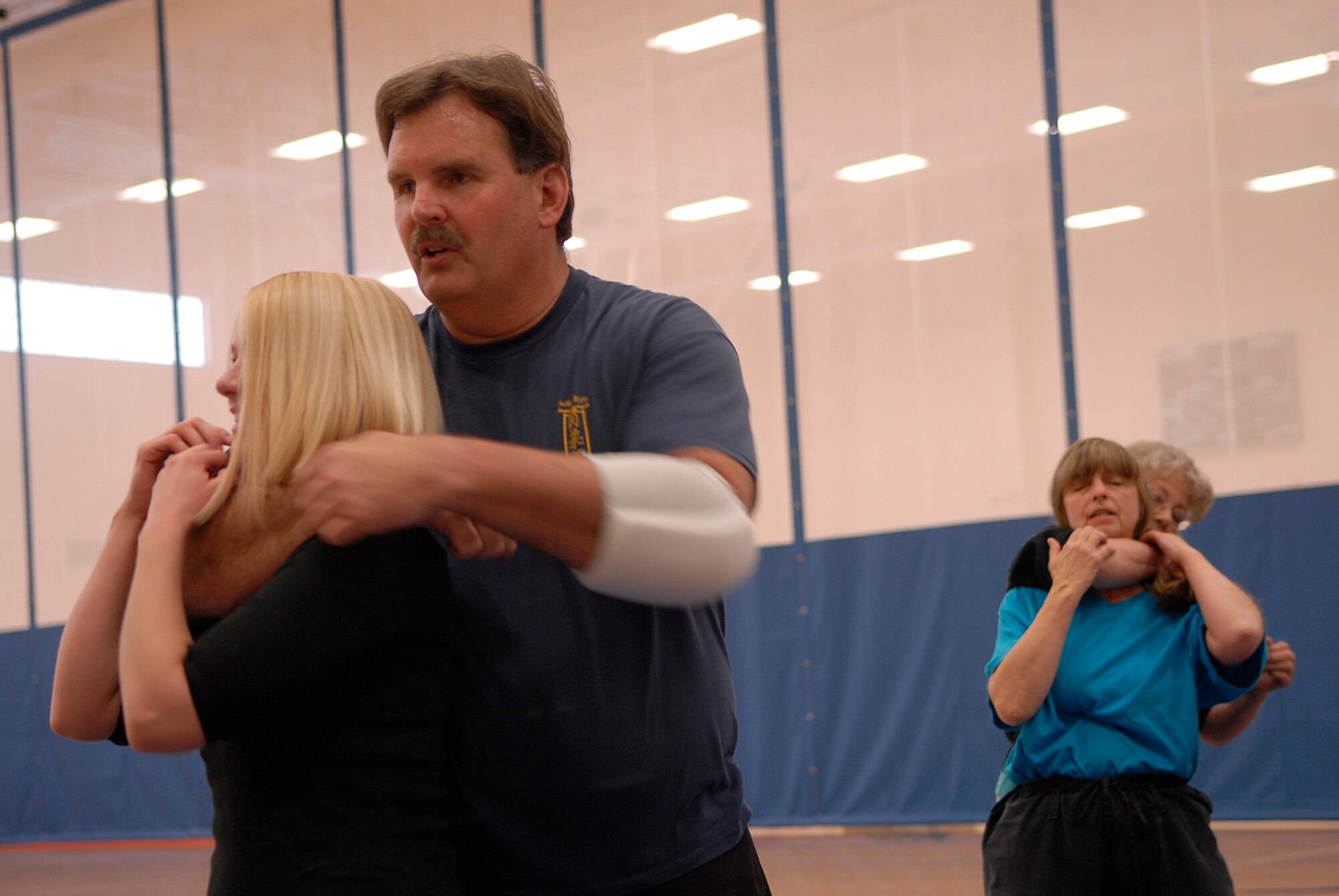 VANDENBERG AIR FORCE BASE, Calif. -- Mr. Randy Ancheta, a third degree Jiu-Jitsu black belt sensei, teaches Ms. Rachel Tucker how to get out of a rear choke hold during a self defense workshop at the base fitness center here Wednesday, April 28, 2010.  The instructors taught the participants in the workshop to not panic and to be aware of their environment.  (U.S. Air Force photo/Senior Airman Andrew Satran) 

 

 

 

 

 

 

 