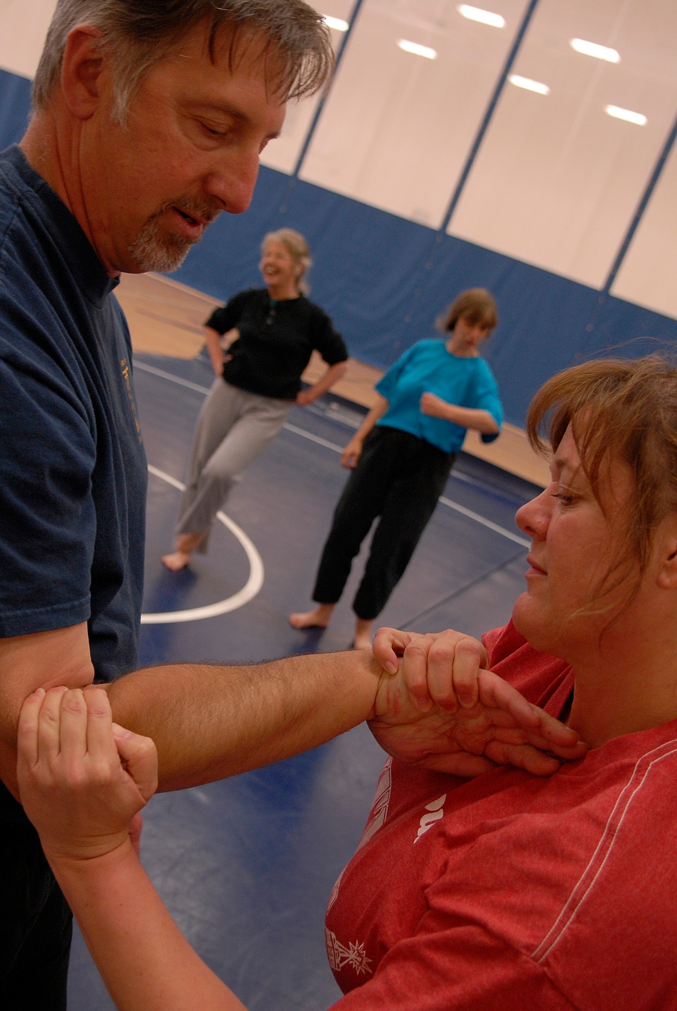 VANDENBERG AIR FORCE BASE, Calif. -- Ms. Michelle Diederichs applies a joint lock technique to Mr. Terry Briggs, a third degree Jiu-Jitsu black belt, during a self defense workshop at the base fitness center here Wednesday, April 28, 2010.  The instructors taught the participants in the workshop to not panic and to be aware of their environment.  (U.S. Air Force photo/Senior Airman Andrew Satran) 

 

 

 

 

 