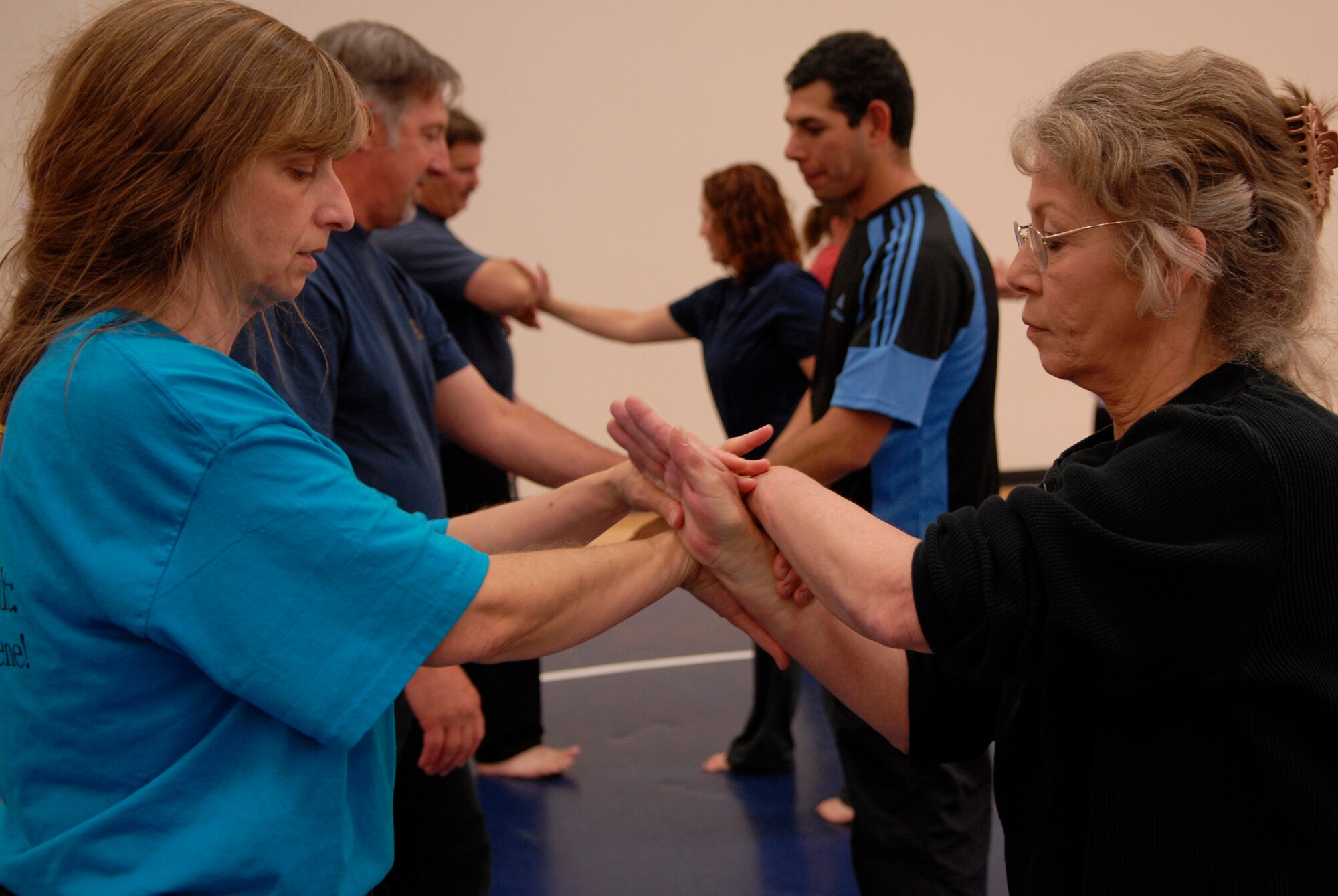 VANDENBERG AIR FORCE BASE, Calif. -- Ms. Valerie Pallai, a second degree Jiu-Jitsu black belt instructor, teaches Ms. Sheryl Meyer how to release herself during a self defense workshop at the base fitness center here Wednesday, April 28, 2010.  The workshop was held in support of Sexual Assault Awareness Month to teach participants how to safely remove themselves from an attacker.  (U.S. Air Force photo/Senior Airman Andrew Satran) 

 

 