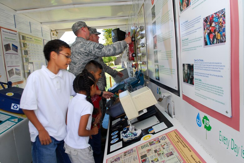 VANDENBERG AIR FORCE BASE, Calif. -- Airmen and youth walk through the education box to learn about recycling and proper disposal of recyclable materials during an Earth Day event in front of the base library here Wednesday, April 29, 2010. (U.S. Air Force photo/Senior Airman Andrew Satran) 

 

 

 
 

 

 

 

 