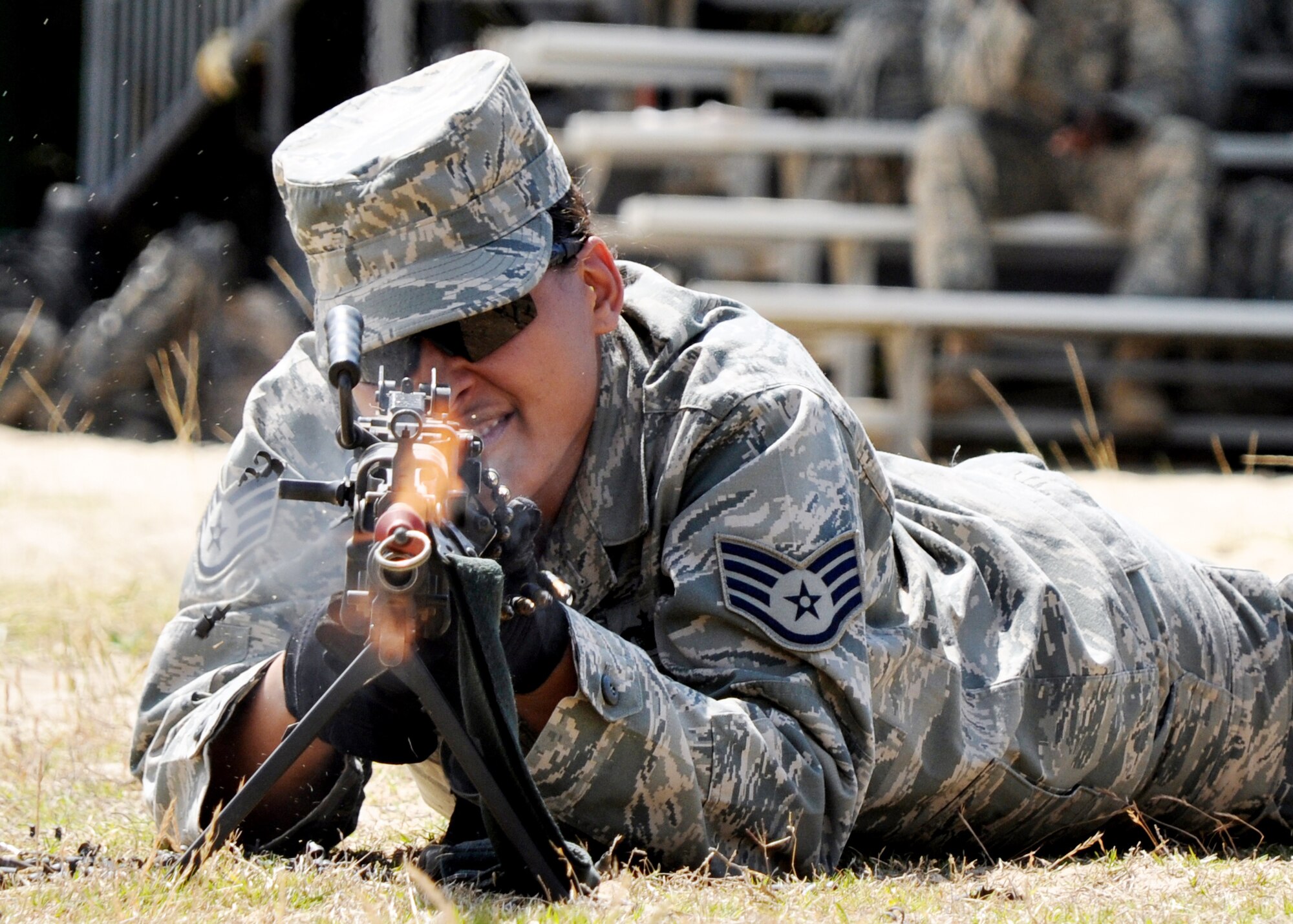 A security forces Airman fires blanks from an M249 machine gun during the weapons familiarization portion of Brave Defender training April 22, 2010. at Eglin Air Force Base, Fla. (U.S. Air Force photo/Airman 1st Class Anthony Jennings)
