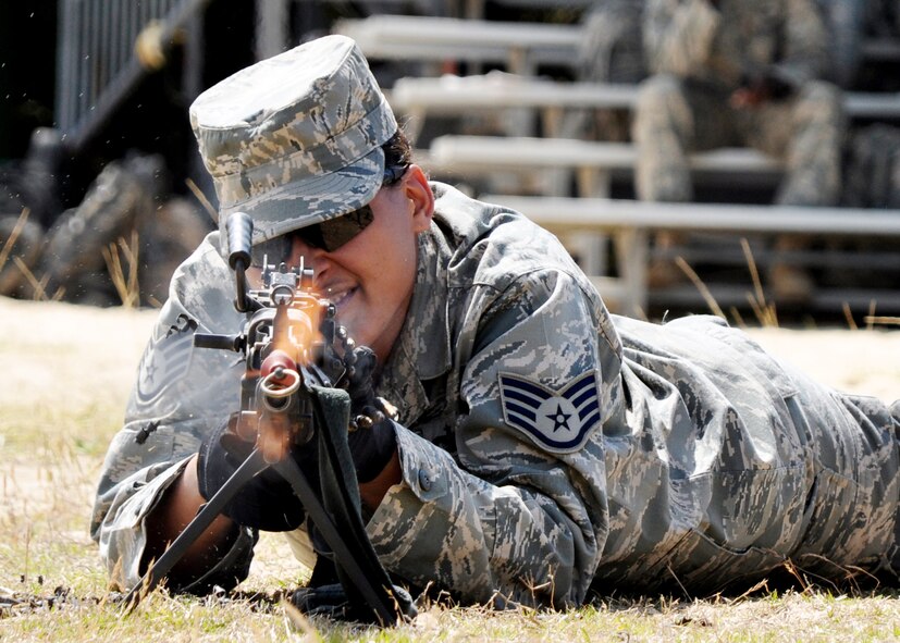 A security forces Airman fires blanks from an M249 machine gun during the weapons familiarization portion of Brave Defender training April 22, 2010. at Eglin Air Force Base, Fla. (U.S. Air Force photo/Airman 1st Class Anthony Jennings)
