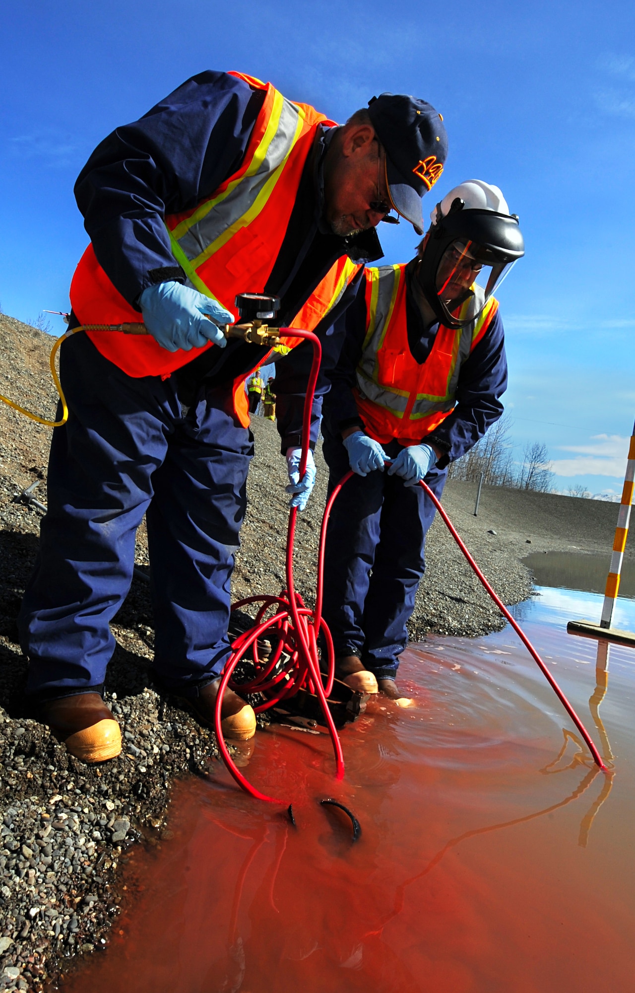 ELMENDORF AIR FORCE BASE, Alaska – Members of the 3rd Civil Engineer Squadron Spill Response Team install an air expandable valve to stop a simulated oil leak during Arctic Edge 10, April 27. Arctic Edge 10 is a major exercise conducted in cooperation with the State of Alaska Division of Homeland Security and Emergency Management and other federal, state and local agencies. (Air Force photo by Senior Airman Cynthia Spalding)