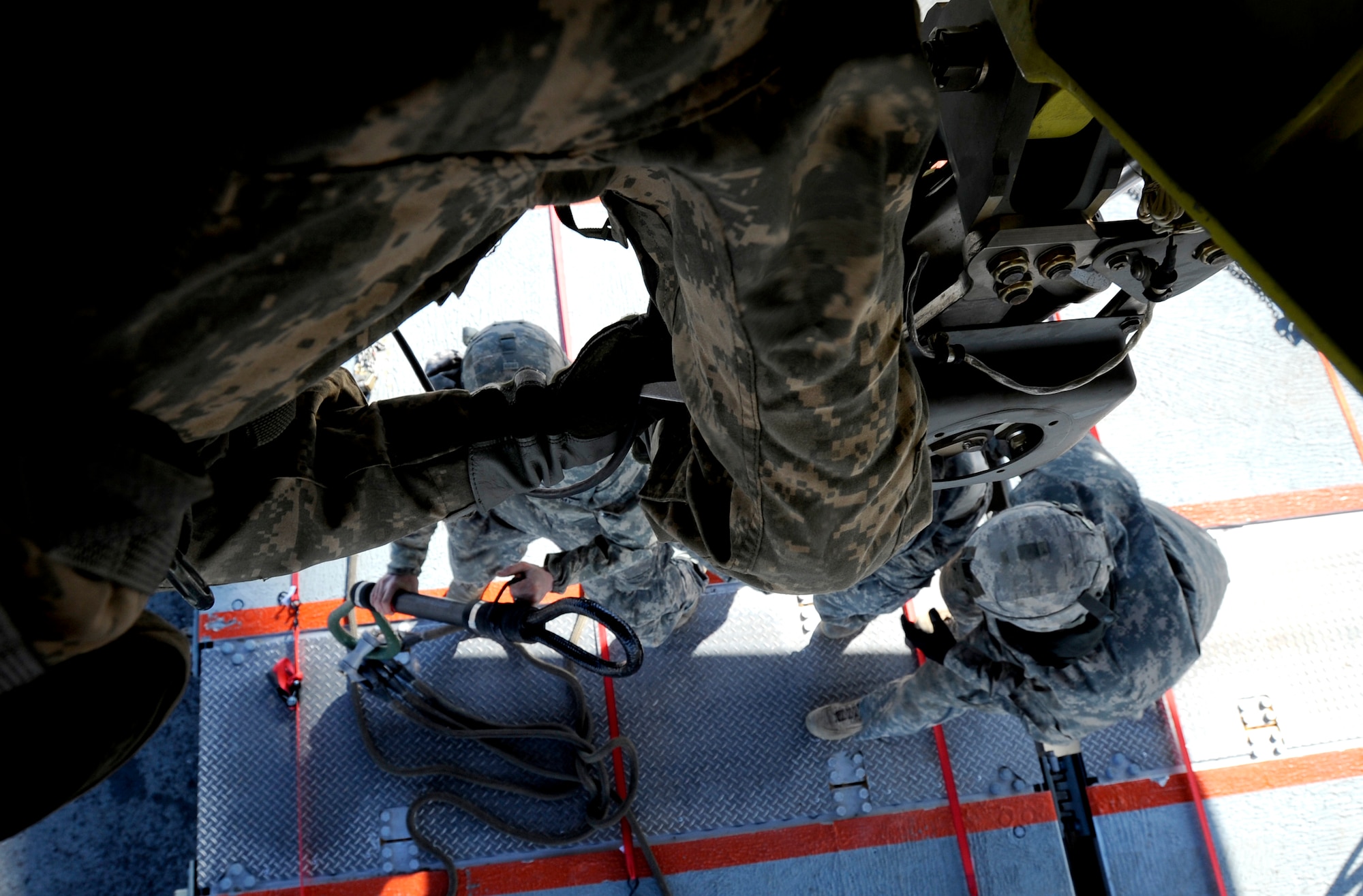 Soldiers from the 84th Engineer Support Company, 6th Engineer Battalion, sling-load a section of Lightweight Modular Causeway System to a CH-47 Chinook during testing at Fort Richardson, Alaska, April 27. The LMCS is a hybrid fixed bridging system and floating causeway system.  Originally designed for vessel-to-shore bridging applications, it has proven ideally suited for wet-gap crossing solutions.  The load capacity is 70 tons. Here it is being used to respond during Arctic Edge 2010 as an earthquake recovery tool. (U.S. Air Force photo/Staff Sgt. Brian Ferguson)