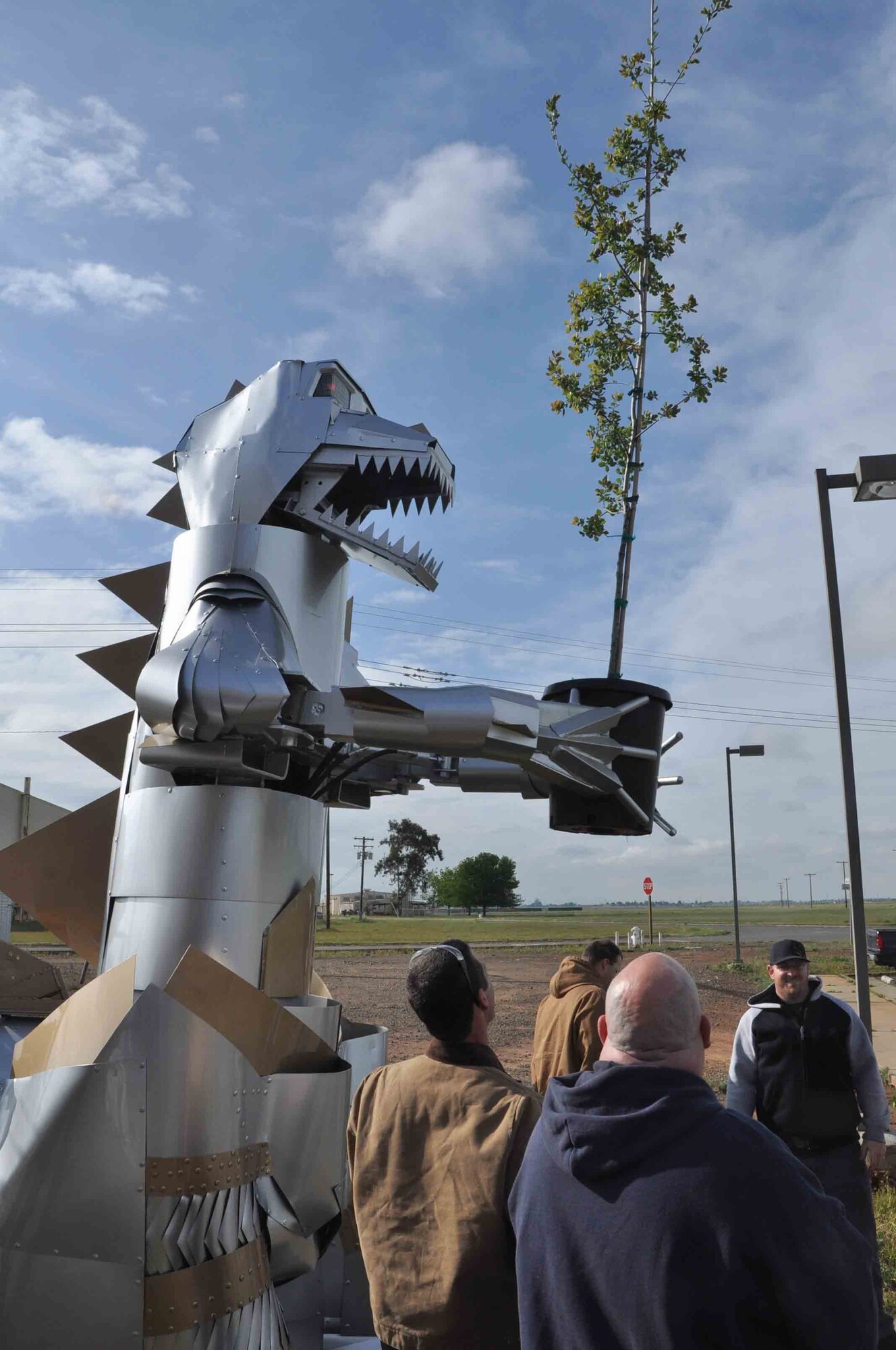 DieselZilla, a robot built by students in the American River College clean diesel program at Mather, helped them plant a Live Valley Oak. Students learn to repair and retrofit trucks and buses in the former Air Force diesel equipment repair shop.[Photo by: Scott Johnston] To see all photos from Trees Across America visit our website at <a href="http://www.safie.hq.af.mil/afrpa">http://www.safie.hq.af.mil/afrpa</a>
