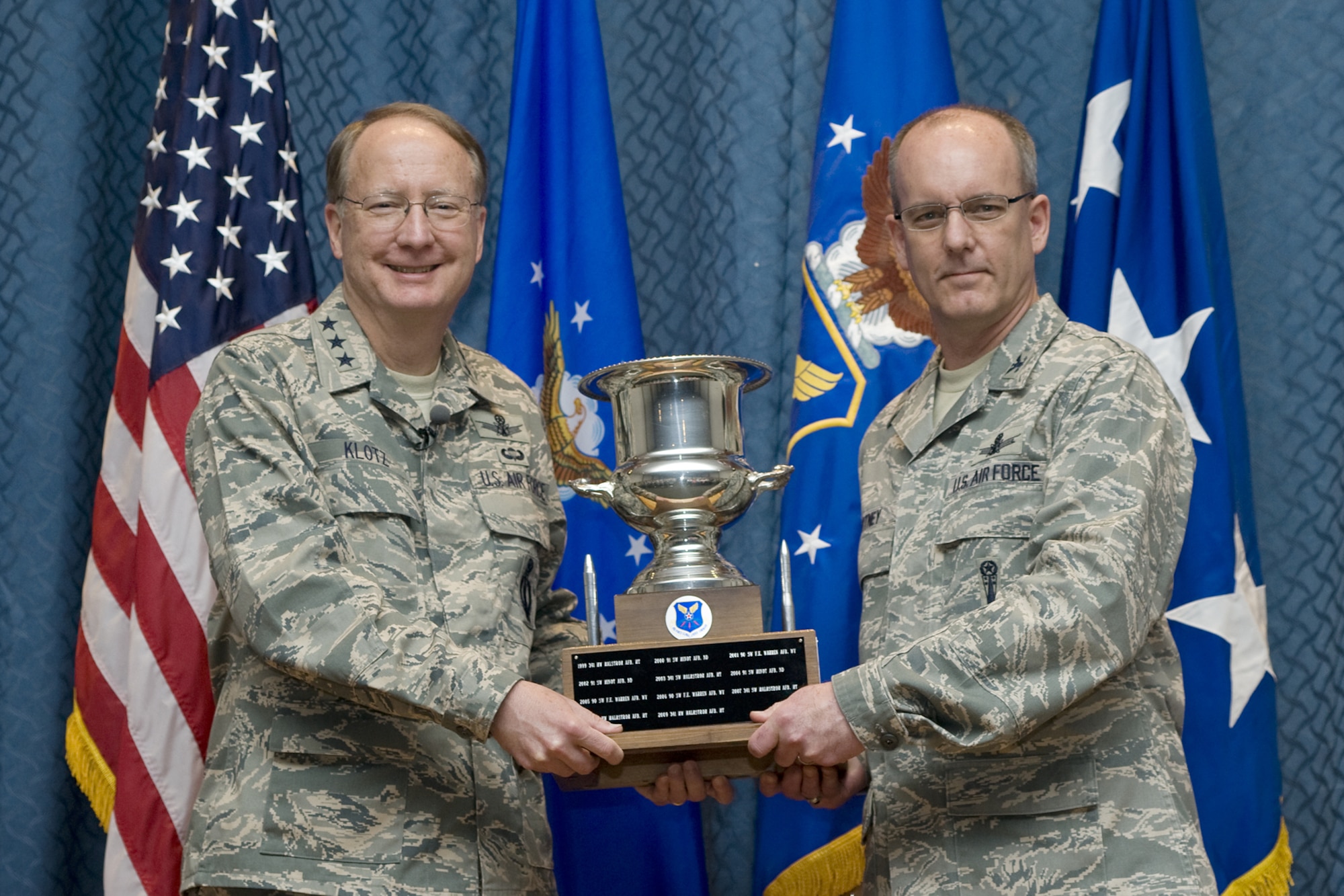 Lt. Gen. Frank Klotz, Air Force Global Strike Command commander, and Col. Michael Fortney, 341st Missile Wing commander, hold the Colonel Lee R. Williams Memorial Award for the best missile wing in the command. General Klotz presented the award to Malmstrom during an officer and senior noncommissioned officer call April 21. (U.S. Air Force photo/Beau Wade)