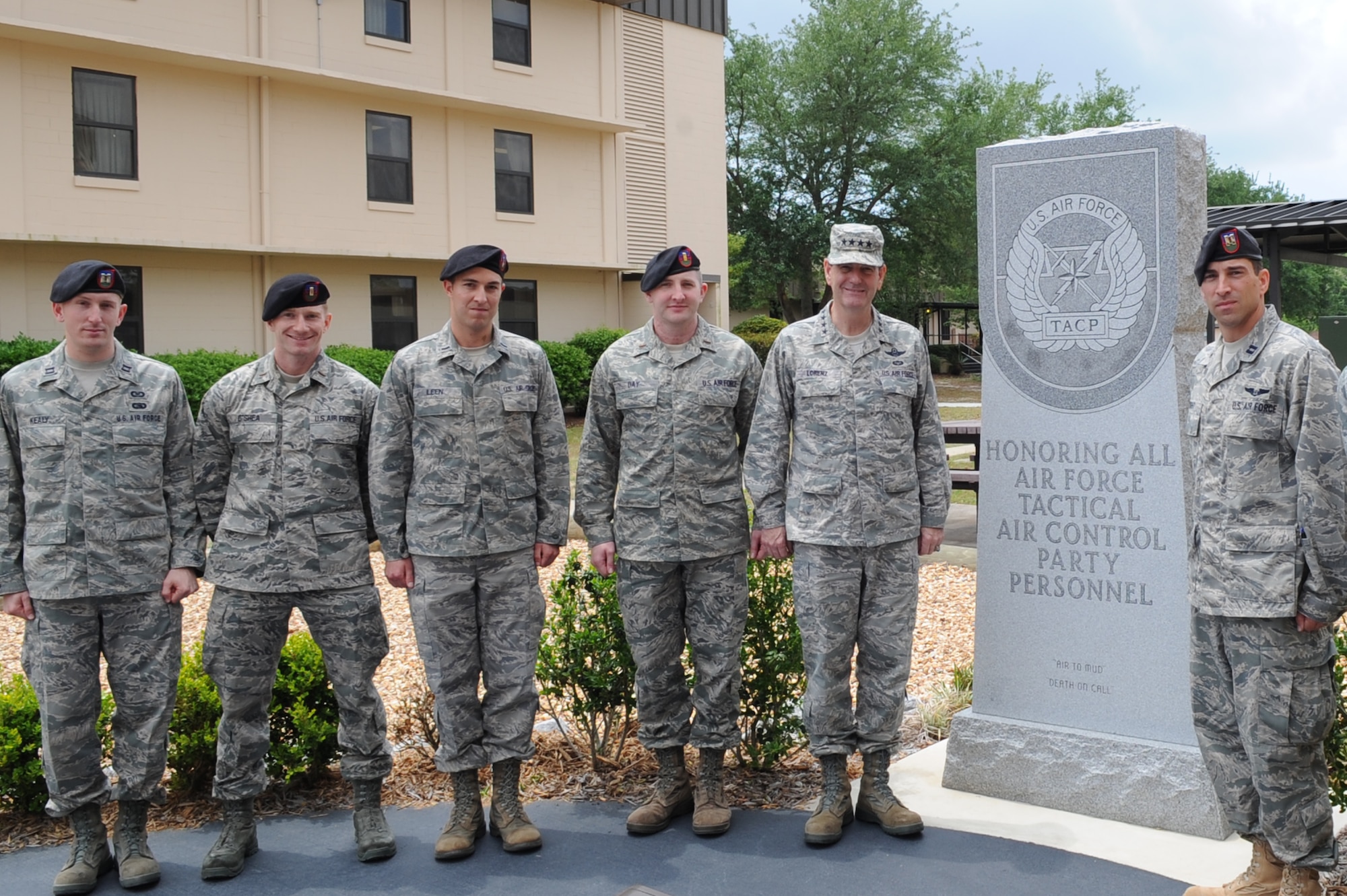 From left to right, Capt. Matthew Kealy, 2nd Lt. Eamonn O’shea, 1st Lt. Brian Leen and 2nd Lt. John Day pose in front of a memorial alongside General Stephen Lorenz, Air Education and Training Command commander and Capt. Christopher Wright, 342nd Training Squadron Detachment 3 commander, after graduating from the Terminal Air Control Party schoolhouse April 27. The Airmen were the first non-rated officers to graduate from the schoolhouse and become air liaison officers in Air Force history. (DoD photo by Air Force Airman Caitlin O'Neil-McKeown)