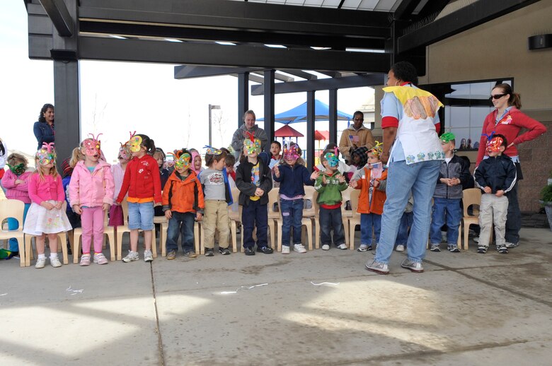 BUCKLEY AIR FORCE BASE, Colo. --The A-Basin Child Development Center pre-school children perform the patriotic song "You're A Grand Old Flag" during the Month of the MIlitary Child kick-off ceremony March 31. (U.S. photo by Airman 1st Class Paul Labbe)