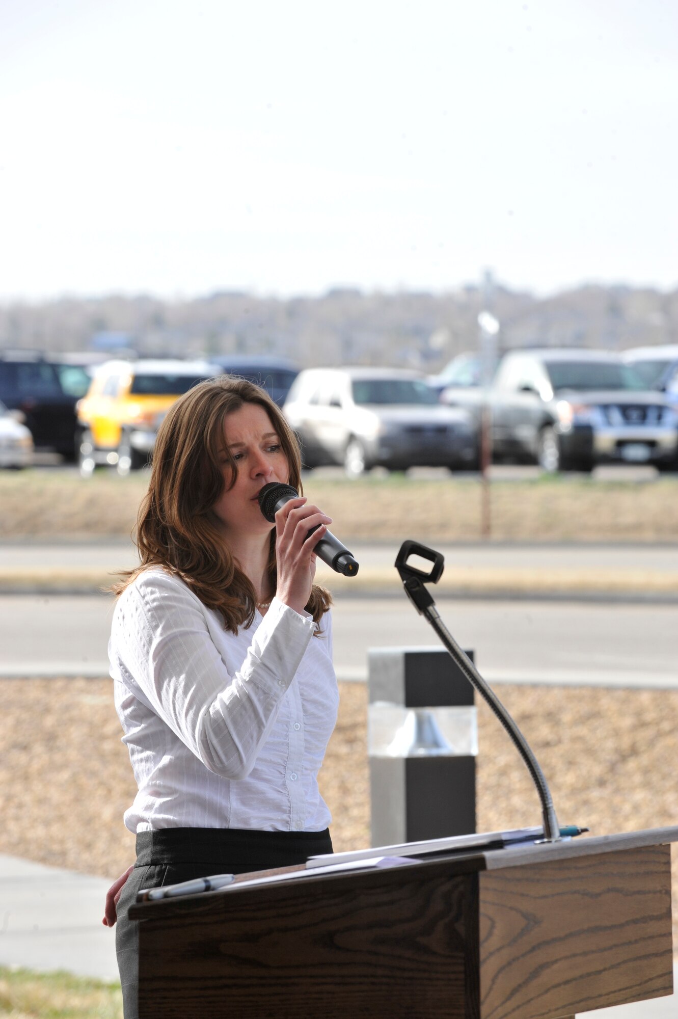 BUCKLEY AIR FORCE BASE, Colo. -- Olivia Pierce, 460th Force Support Squadron, performs "God Bless America" during the Month of the Military child kick-off ceremony March 31 at the A-Basin Child Development Center. (U.S. photo by Airman 1st Class Paul Labbe)