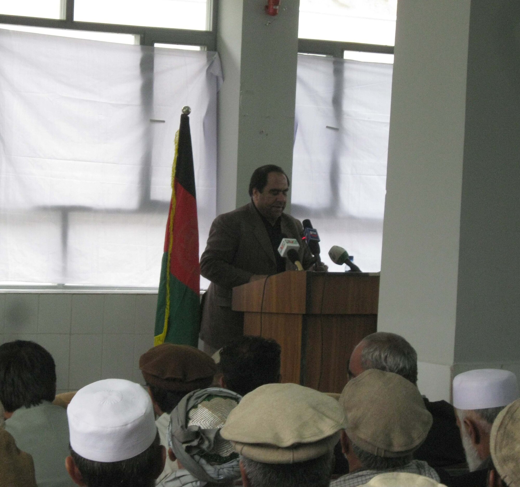 Panjshir Provincial Gov. Keramuddin Keram gives his first speech as governor during an April 26 transfer-of-authority ceremony at the Panjshir Provincial Afghan National Police Headquarters, Afghanistan. Hundreds of Afghans packed the standing-room-only auditorium. A small group of leadership from Provincial Reconstruction Team Panjshir also attended. (Photo by U.S. Air Force 2nd Lt. Jason Smith, Provincial Reconstruction Team Panjshir)