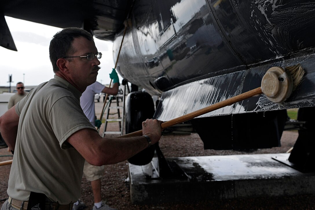 ELLSWORTH AIR FORCE BASE, S.D. – Master Sgt. Eric Petersen, 28th Security Forces Squadron plans and programs manager, washes an F-111 Aardvark at the South Dakota Air and Space Museum, April 28. Currently, 18 squadrons have sponsored an aircraft at the museum. The sponsorship instills unit pride, camaraderie and shows visitors from around the world Air Force history, heritage and honor. (U.S. Air Force photo/Airman 1st Class Matthew Flynn)