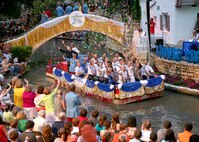 Gen. Stephen Lorenz, commander of Air Education and Training Command, and military ambassadors from the Air Force, Navy, Army and Marine Corps wave to spectators during the Texas Cavaliers River Parade April 19 in downtown San Antonio. Ambassadors from local military bases attend a variety of functions throughout the Fiesta celebration. (U.S. Air Force photo by Robbin Cresswell)