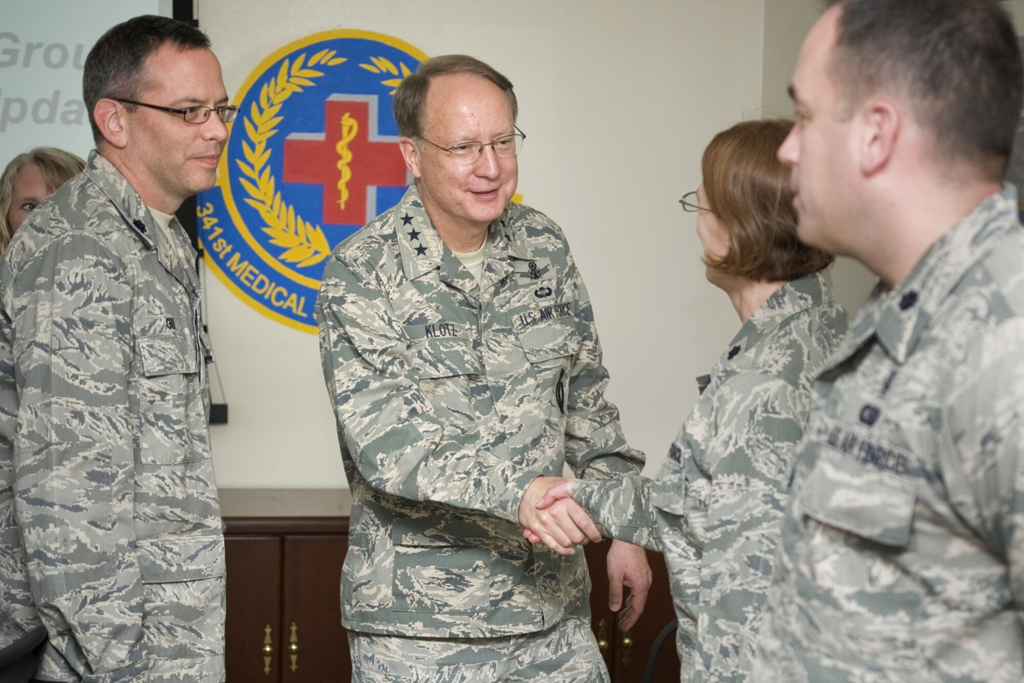 Lt. Gen. Frank Klotz, Air Force Global Strike Command commander, exchanges greetings with members of the 341st Medical Group during his visit to Malmstrom April 20-22. Pictured from left to right are Lt. Col. Dale Grey, 341st Medical Operations Squadron commander;  Lt Col. Jennifer Ravenscroft, 341st Medical Group Chief of Medical Services; and Lt. Col. Paul Toth, 341st Medical Group administrator. The medical group was one of several areas the commander visited while here. (U.S. Air Force photo/Beau Wade)