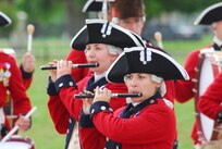 Members from the U.S. Army Old Guard Fife and Drum Corps march during the Fort Sam Houston Fiesta Ceremony and Fireworks Extravaganza April 18. In addition to Fiesta, the corps performs at more than 500 events annually, including arrival ceremonies for heads of state at the White House. (U.S. Air Force photo by Alan Boedeker)