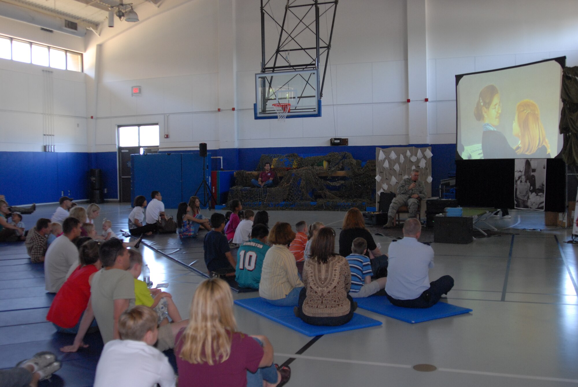 Maj. Gen. Kurt Cichowski, Air Force Special Operations Command vice commander, reads the book "Mercedes and the Chocolate Pilot" to children during the Military Child Education Coalition's "Tell Me a Story" program hosted by the Airman & Family Readiness Center's School Liaison Program at Hurlburt Field, April 25. The book reading was scheduled as part of the base's events for the Month of the Military Child. (DoD photo by U. S. Air Force Staff Sgt. Orly N. Tyrell/Released)