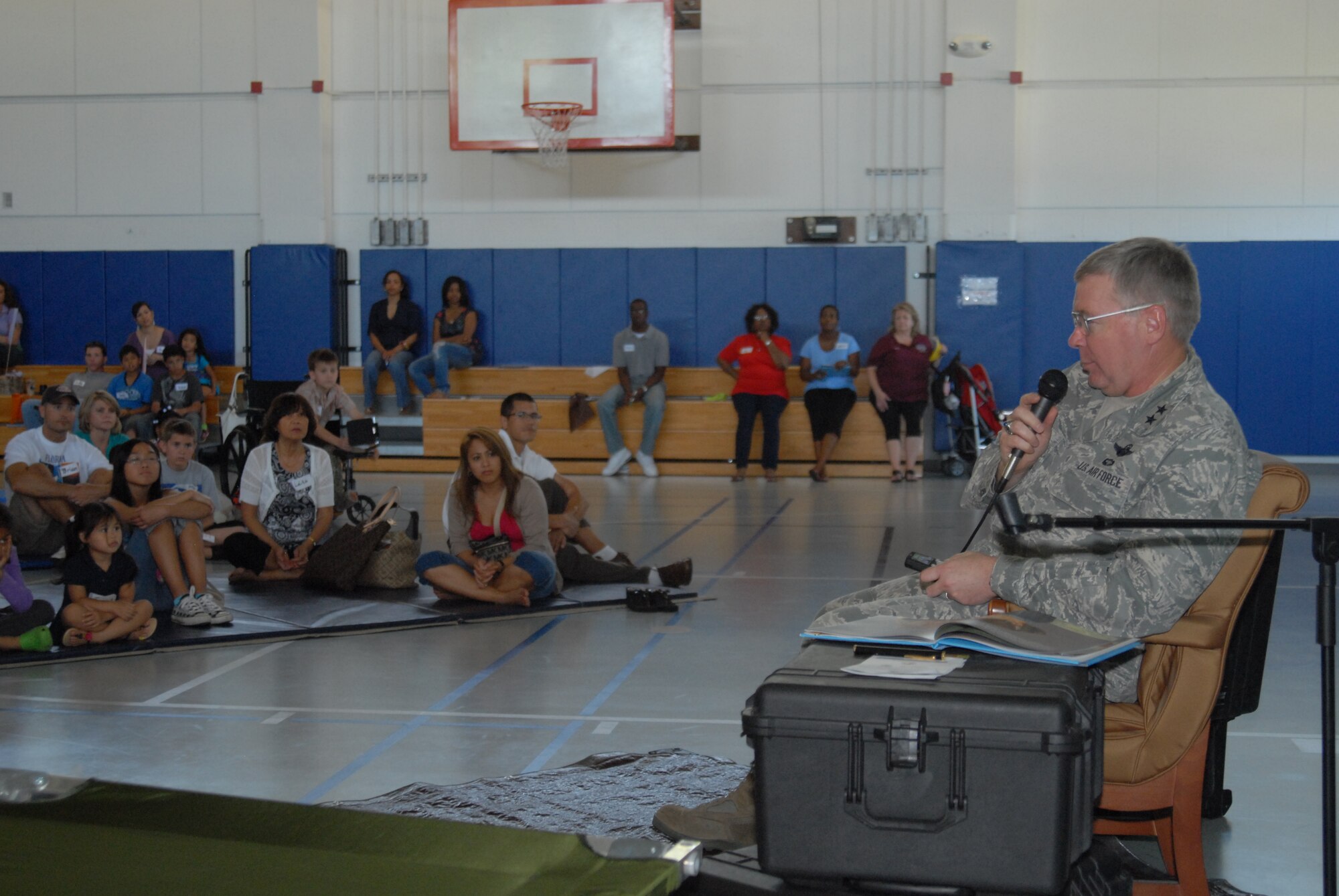 Maj. Gen. Kurt Cichowski, Air Force Special Operations Command vice commander, reads the book "Mercedes and the Chocolate Pilot" to children during the Military Child Education Coalition's "Tell Me a Story" program hosted by the Airman & Family Readiness Center's School Liaison Program at Hurlburt Field, April 25. The book reading was scheduled as part of the base's events for the Month of the Military Child. (DoD photo by U. S. Air Force Staff Sgt. Orly N. Tyrell/Released)