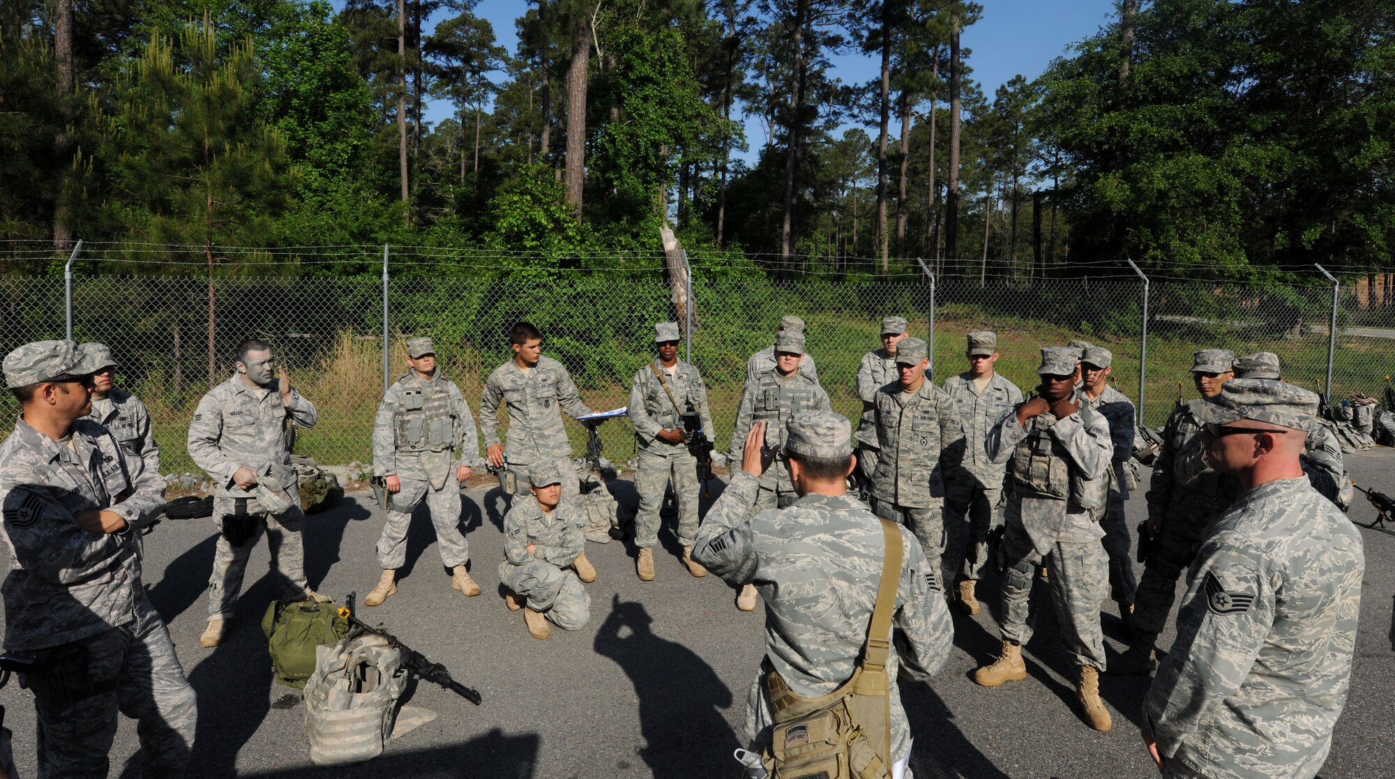 MOODY AIR FORCE BASE, Ga. -- Senior Airman Krystoffer Miller, 822nd Security Forces Squadron fire team leader, wipes the sweat from his forehead after completing the entry control point portion of the validation exercise here April 27. The validation exercise tested the warrior skills of the members from the 822nd SFS by forcing them to react during real-world scenarios. (U.S. Air Force photo by Airman 1st Class Benjamin Wiseman/RELEASED)