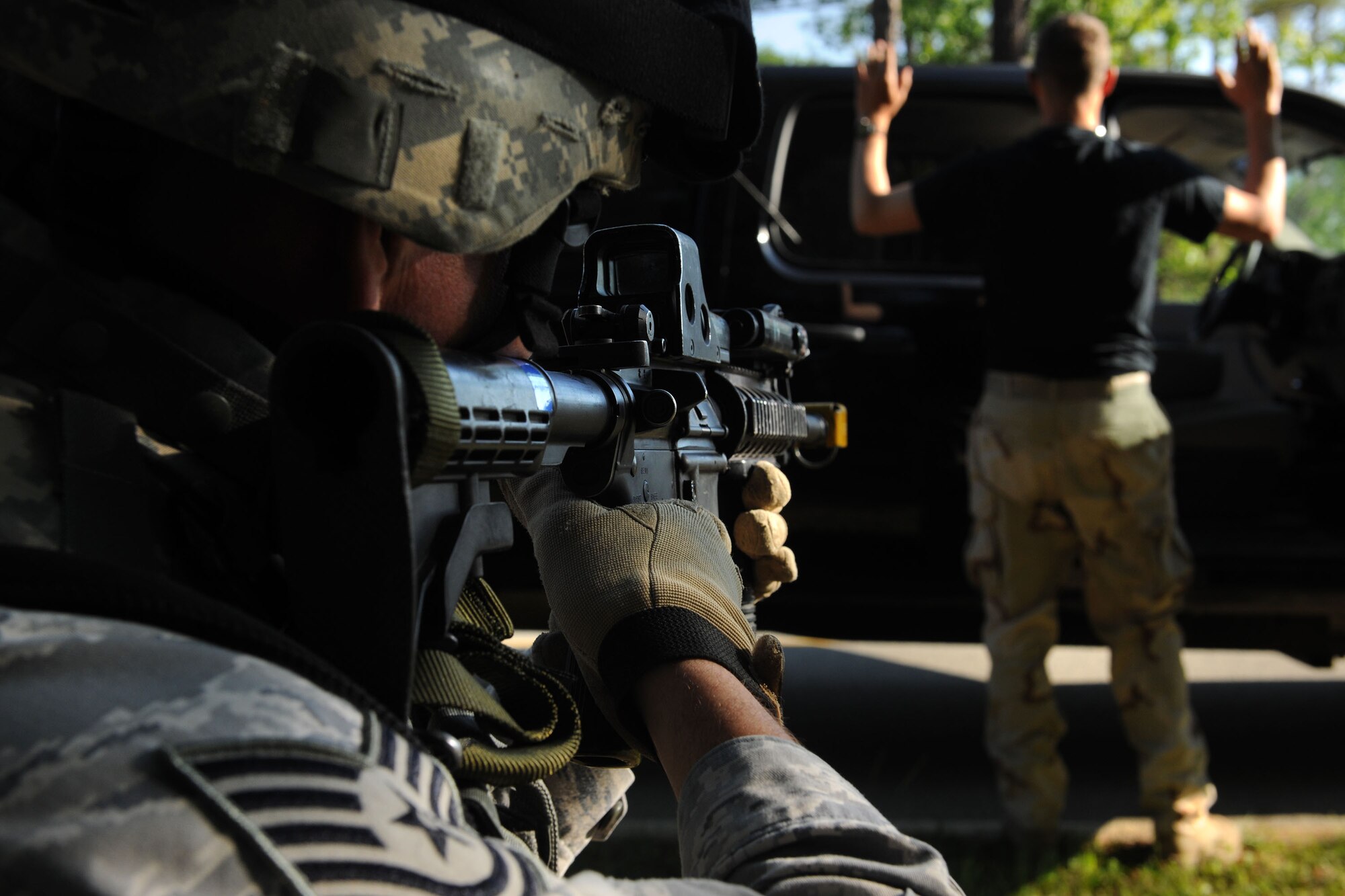 MOODY AIR FORCE BASE, Ga. -- Tech. Sgt. Tony Potter, 822nd Security Force Squadron canine unit NCO in-charge, aims his rifle at a simulated suspect during a validation exercise here April 27. Sergeant Potter and his fire team were being evaluated on their response to a possible real-world scenario. (U.S. Air Force photo by Airman 1st Class Benjamin Wiseman/RELEASED)