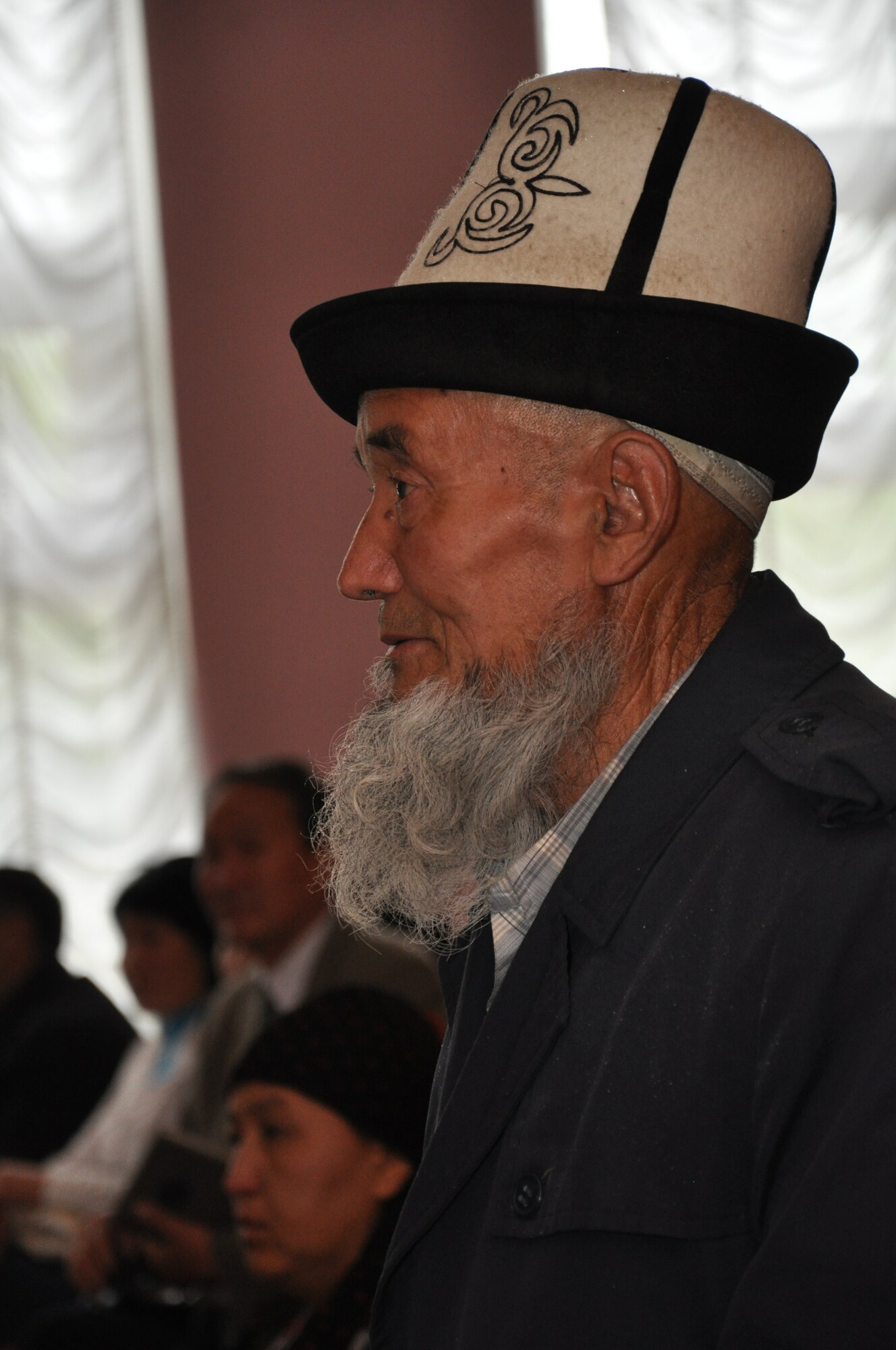 The grandfather of a fallen Kyrgyz man who, among many, was slain during the recent unrest in Kyrgyzstan speaks during a memorial service for five men in TokMok April 29, 2010.  U.S. Airmen from the Transit Center at Manas attended the ceremony to honor them and donated dry and household goods to assist their surviving family members. (U.S. Air Force photo/Staff Sgt. Carolyn Viss)