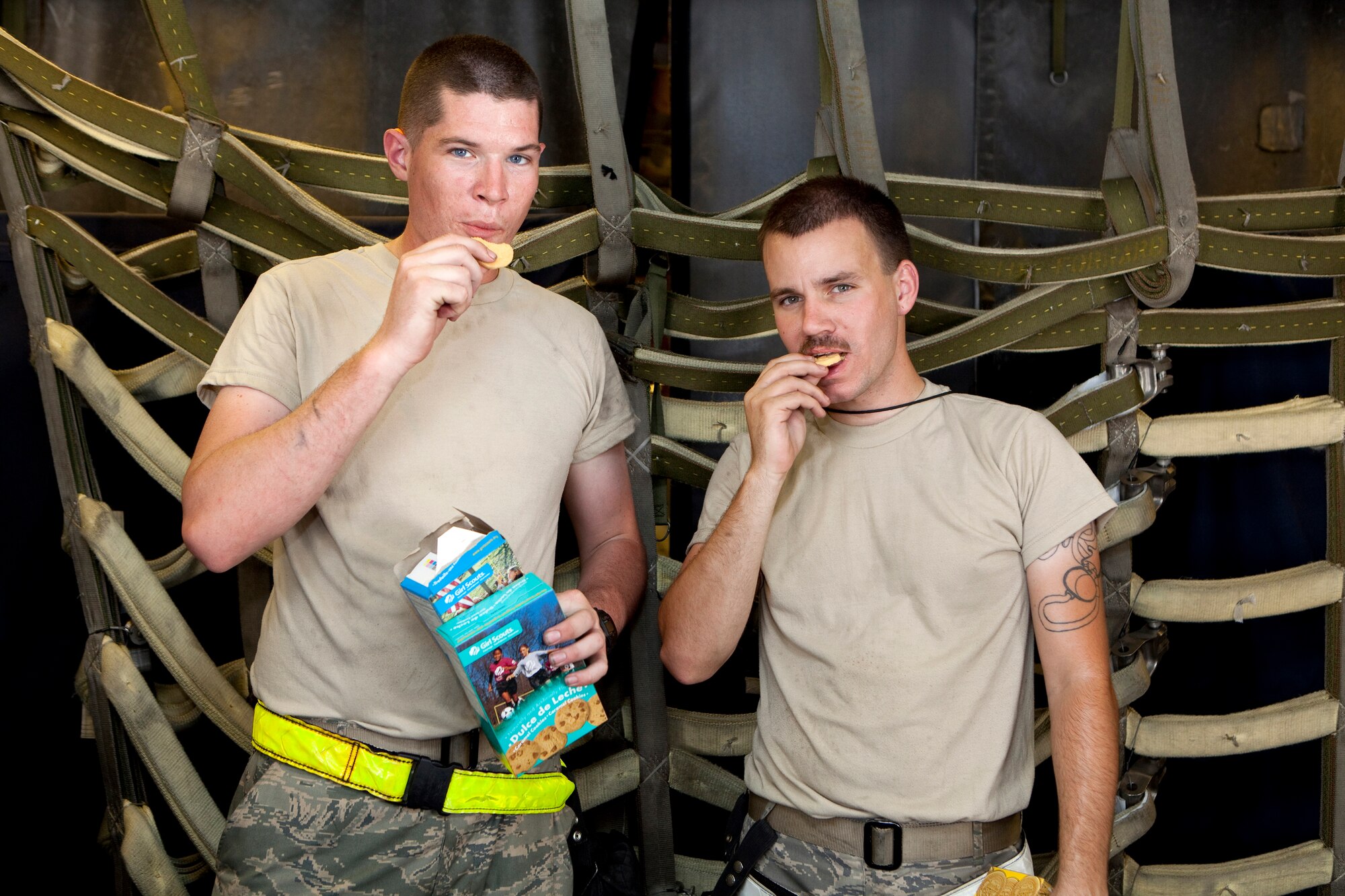 Recently the hearts of deployed 380th Air Expeditionary Wing Airmen at an undisclosed location in Southwest Asia were warmed when they received a sweet gesture from California Girl Scouts in the form of 1,800 boxes of Girl Scout Cookies. Junior Troop #361 in Vacaville, Calif. sent the cookies which have made their way all over base. These Airmen are enjoying some of their favorites while on break inside a KC-10 Extender aircraft where they serve as maintainers. (U.S. Air Force photo/Staff Sgt. Leonel Gallardo/released)