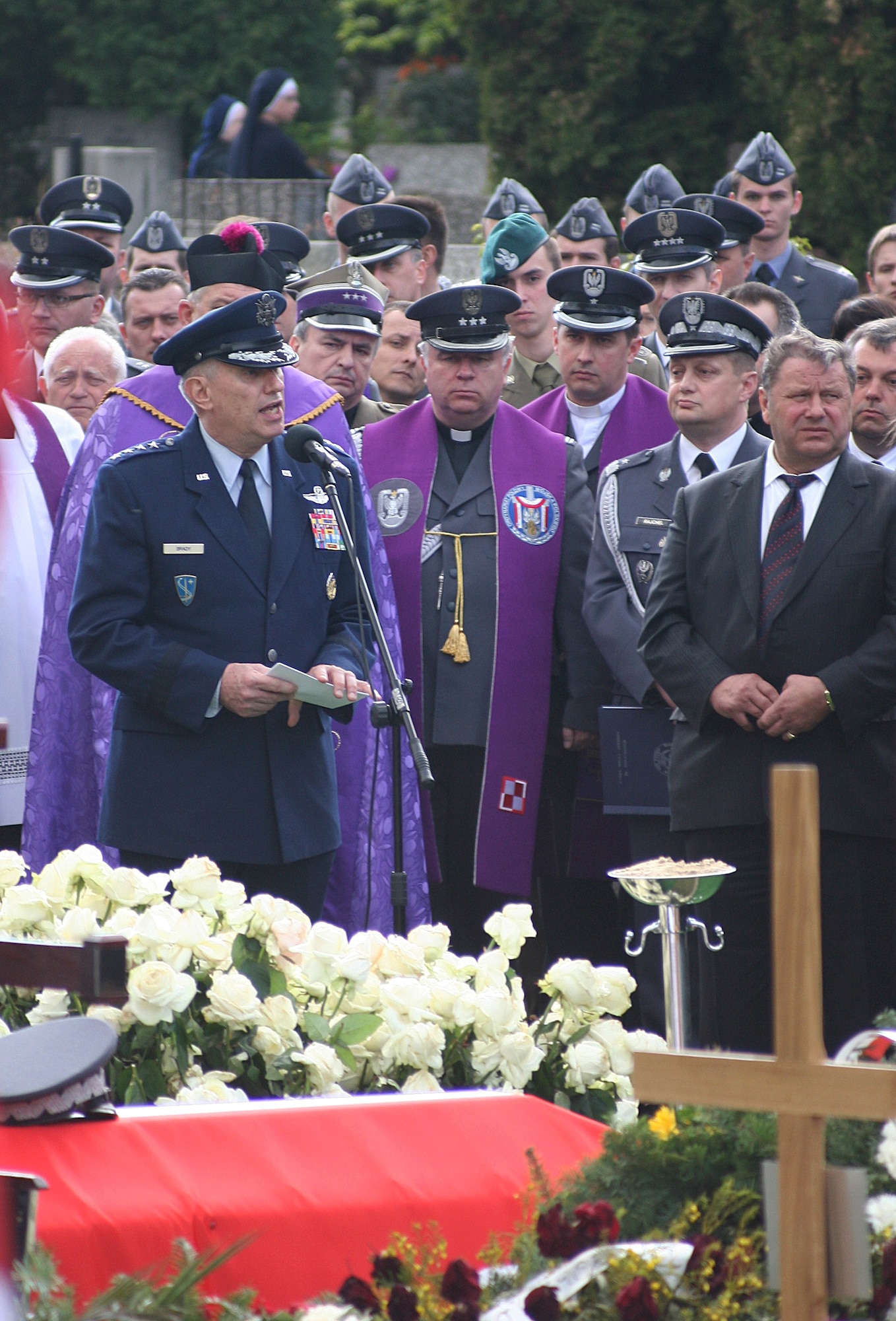 WARSAW, Poland -- Gen. Roger Brady, U.S. Air Forces in Europe and NATO Allied Air Command Ramstein commander, makes remarks on behalf of NATO air chiefs, USAFE and the U.S. Air Force during funeral services for Polish air force commander Gen. Andrzej Blasik April 28, 2010, in Warsaw’s Powazki cemetery. General Blasik died April 10 alongside Polish president Lech Kaczynski and many other top Polish military leaders when the Polish air force Tu-154 plane he was on crashed in a forest outside the military airport in Smolensk, Russia, en route to commemorate the 70th anniversary of the Katyn massacre by the Soviet Union’s secret police. (U.S. Air Force photos/Lt. Col. Pamela A.Q. Cook)