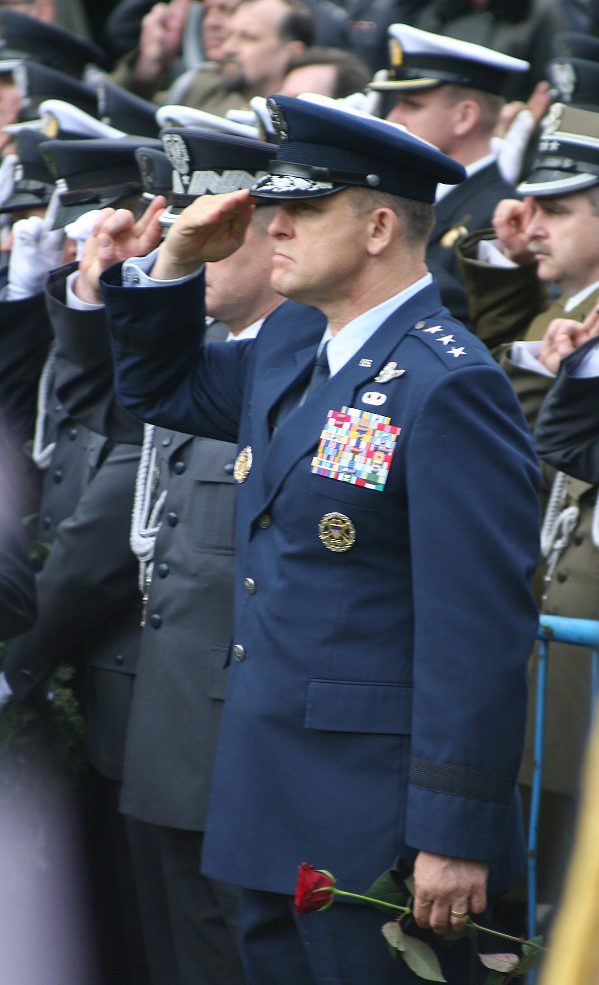 WARSAW, Poland -- Lt. Gen. Frank Gorenc, 3rd Air Force commander, salutes while the Polish national anthem is played during funeral services for Polish air force commander Gen. Andrzej Blasik April 28, 2010, in Warsaw’s Powazki cemetery. General Blasik died April 10 alongside Polish president Lech Kaczynski and many other top Polish military leaders when the Polish air force Tu-154 plane he was on crashed in a forest outside the military airport in Smolensk, Russia, en route to commemorate the 70th anniversary of the Katyn massacre by the Soviet Union’s secret police. Generals Blasik and Gorenc worked alongside each other on numerous occasions, including working to establish sister wing arrangements to foster interoperability between units using similar equipment to ensure that the two air forces can effectively operate together to meet the goal of the alliance. (U.S. Air Force photos/Lt. Col. Pamela A.Q. Cook)