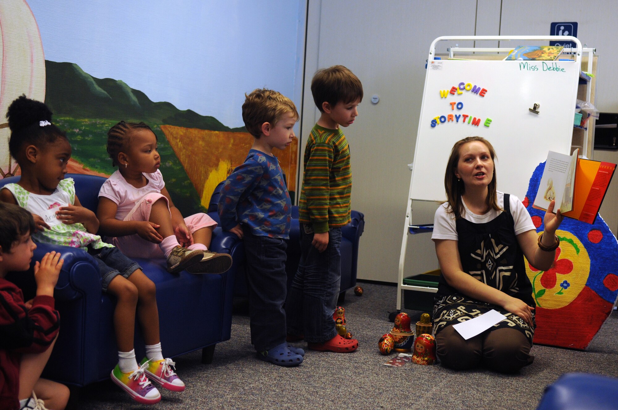 Children gather around at the library on Ramstein Air Base, Germany, April 29, 2010, for the last event in support of Month of the Military Child. The theme for the event was children of the world were the kids were able to learn about Russian, German and Philippine countries and their cultures. (U.S. Air Force photo by Senior Airman Scott Saldukas)