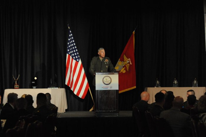 Sgts. Joseph Dickens, Andrew Kelly, Justin Boone, and Jason Penrod salute the commanding officer of Marine Medium Helicopter Squadron 165 during a ceremony at the Flying Leatherneck Aviation Museum here April 30. The ceremony was an unveiling of the newly restored "Lady Ace 09," which was the CH-46E helicopter used to evacuate the American ambassador during the fall of Saigon April 30, 1975.