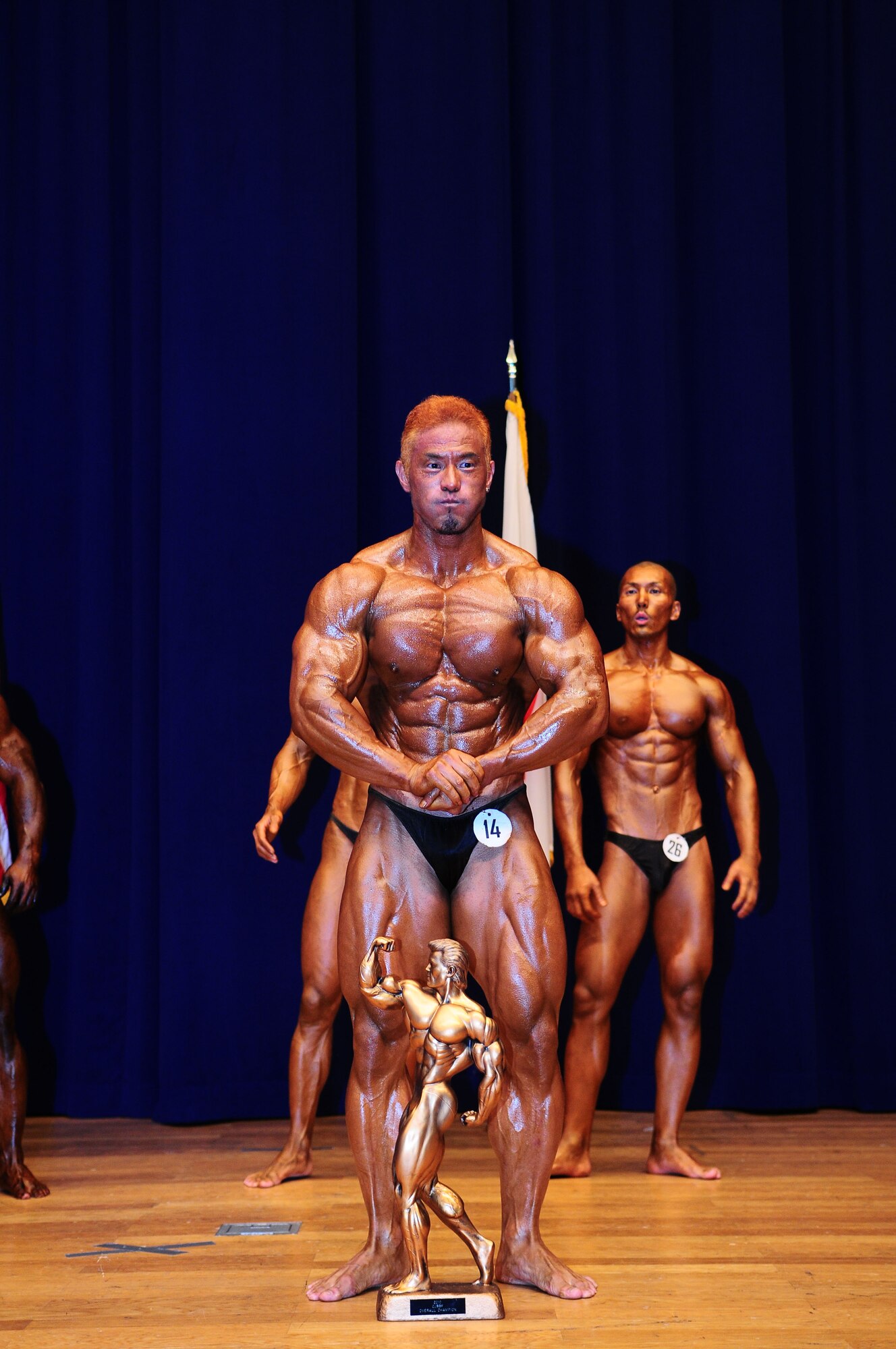 YOKOTA AIR BASE, Japan -- Motoyuki Sakabe, competitor in the Men's Masters Division, poses for the audience August 1 during the 12th Annual 2010 Central Japan Bodybuilding and Figure Championship at the Taiyo Community Center. The CJBBF championship consists of seven different categories that focus on body physique, style, and presentation. (U.S. Air Force photo/Airman 1st Class Sean Martin)