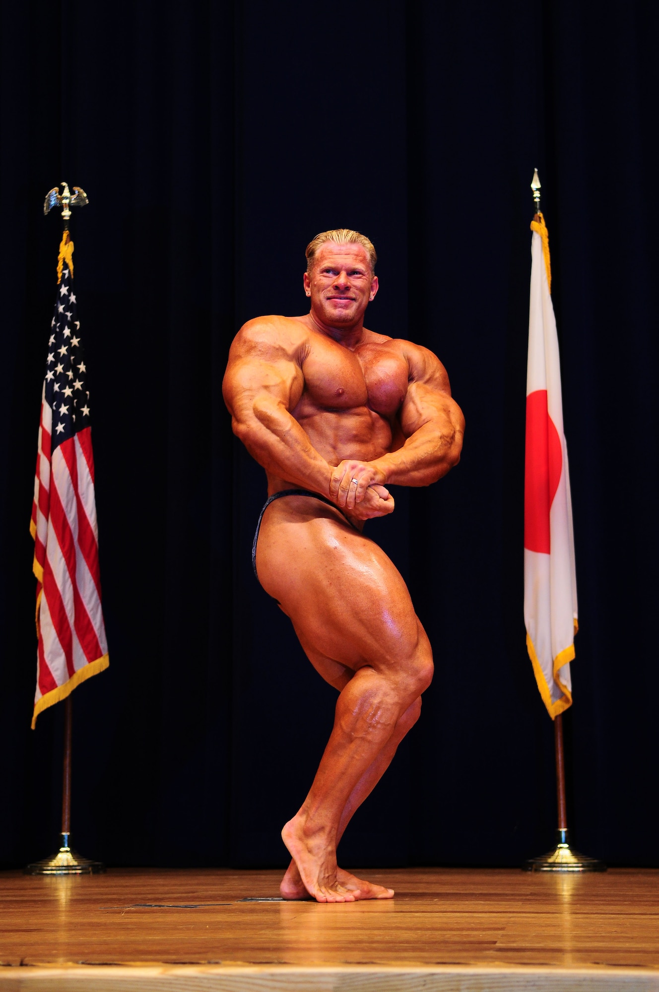 YOKOTA AIR BASE, Japan -- Dennis "Big Bad" Wolf, guest poser, strikes a pose August 1 during the 12th Annual 2010 Central Japan Bodybuilding and Figure Championship at the Taiyo Community Center. The CJBBF championship consists of seven different categories that focus on body physique, style, and presentation.  The overall winner of the championship was Motoyuki Sakabe. (U.S. Air Force photo/Airman 1st Class Sean Martin)