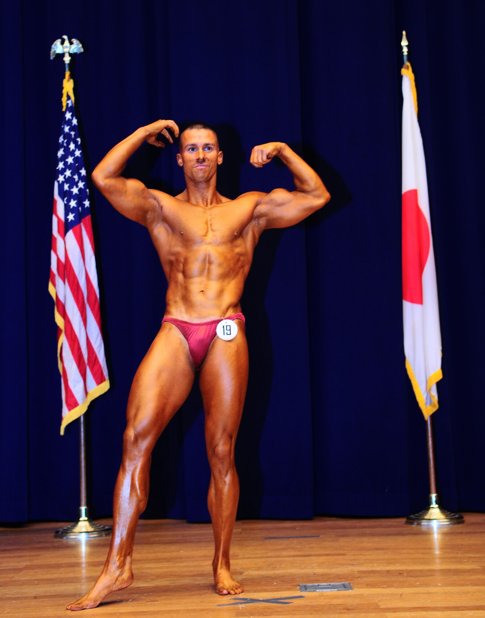 YOKOTA AIR BASE, Japan -- Lt. Col. Kevin Walker, 374th Security Forces Squadron commander, performs his routine August 1 during the 12th Annual 2010 Central Japan Bodybuilding and Figure Championship at the Taiyo Community Center. The CJBBF championship consists of seven different categories that focus on body physique, style, and presentation.  The overall winner of the championship was Motoyuki Sakabe. (U.S. Air Force photo/Airman 1st Class Sean Martin)