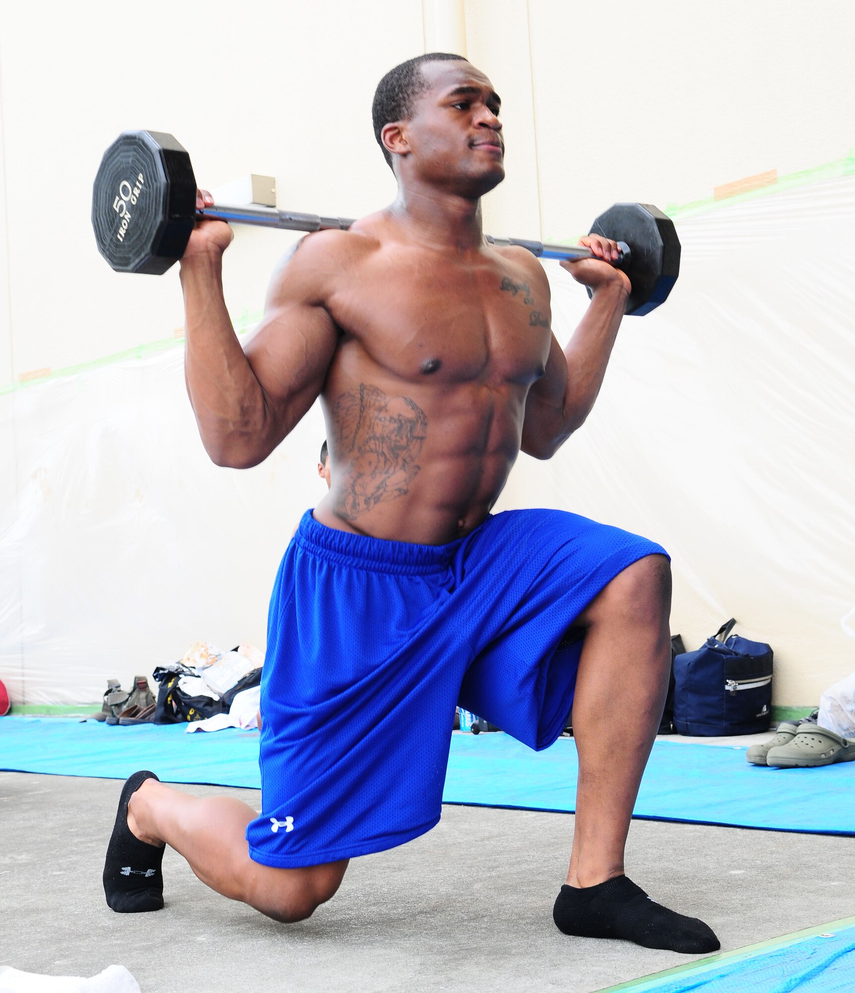 YOKOTA AIR BASE, Japan -- Lequae Caldwell, competitor in the Men's Heavy Weight Division, performs some last minute preparations Aug. 1 during the 12th Annual 2010 Central Japan Bodybuilding and Figure Championship at the Taiyo Recreation Center. The CJBBF championship consists of 7 different categories that focus on body physique, style, and presentation.  The overall winner of the championship was Motoyuki Sakabe. (U.S. Air Force photo/Airman 1st Class Sean Martin)