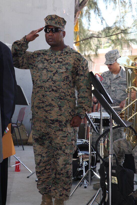 Gunnery Sgt. Felder Domond, a native of Port-au-Prince, Haiti, and supply chief with Combat Logistics Regiment 27, Logistics Combat Element of Special-Purpose Marine Air-Ground Task Force Continuing Promise 2010, renders a salute to the Haiti Nation Anthem during a Friendship Ceremony in Port-de-Paix, Haiti, Aug. 2, 2010. Domond served as a Creole translator for the USS Iwo Jima leaders and key leaders of Haiti. The Marines and Sailors of CP10 are currently deployed to the Caribbean, Central and South America to provide humanitarian civic assistance and disaster relief efforts.