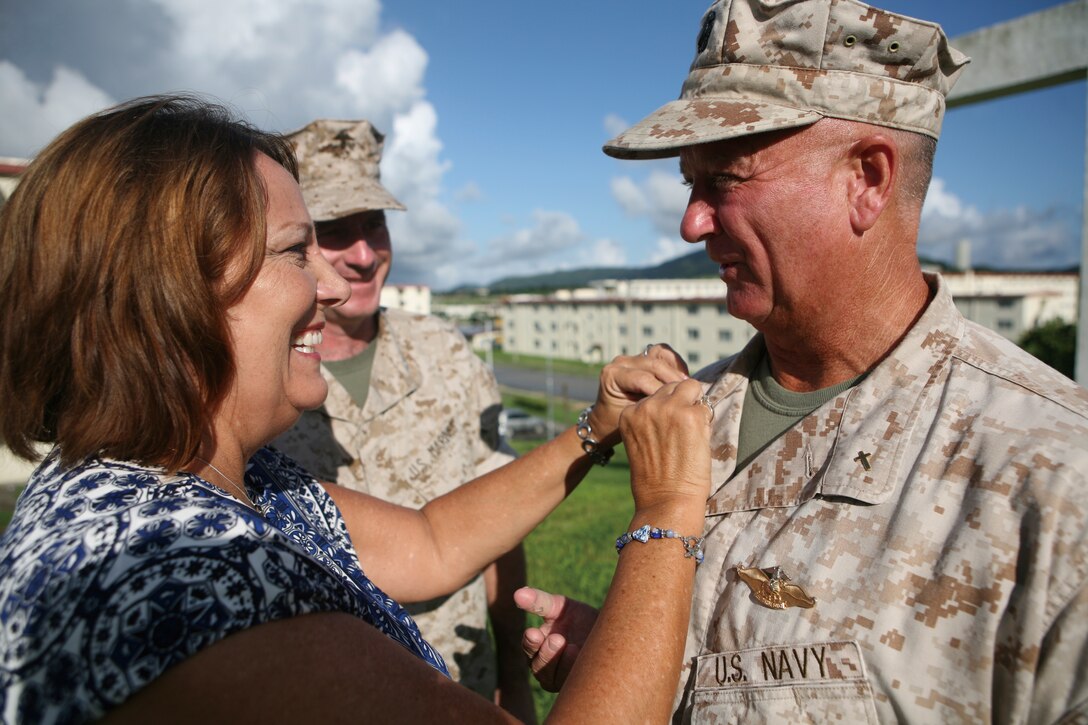 Commander Ray Bailey is pinned by his wife, Melda, during a promotion ceremony at Camp Hansen, Aug. 2. Bailey has been the 31st Marine Expeditionary Unit's Chaplain since 2008.