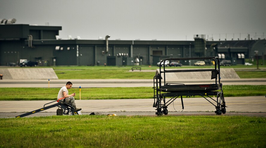 MISAWA AIR BASE, Japan -- Airman 1st Class Christian Rodriguez, 35th Aircraft Maintenance Squadron, 14th Aircraft Maintenance Unit aircraft armament systems apprentice, waits patiently to help shut down a returning F-16 Fighting Falcon Aug. 2. Misawa is Airman Rodriguez's first duty assignment, having recently completed his technical training. (U.S. Air Force photo/Staff Sgt. Samuel Morse)