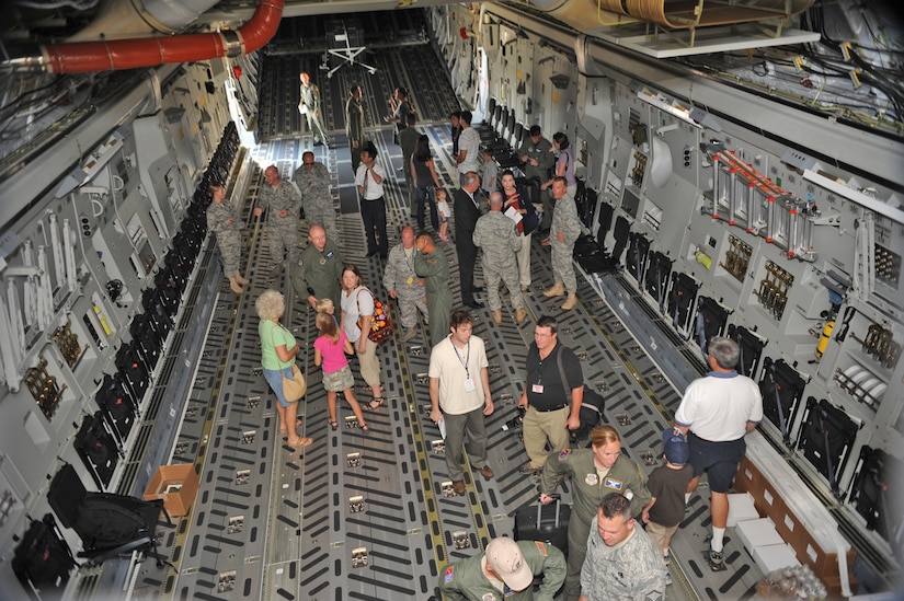 Guests tour the 305th Air Mobility Wing's newest C-17 July 30th. "This C-17 will help exponentially," said Lt. Col. Bryan Wood, 6th Airlift Squadron operations officer. "It will immediately help provide combat airlift in our role of supporting our combatant commanders." (U.S. Air Force photo/Carlos Cintron) 