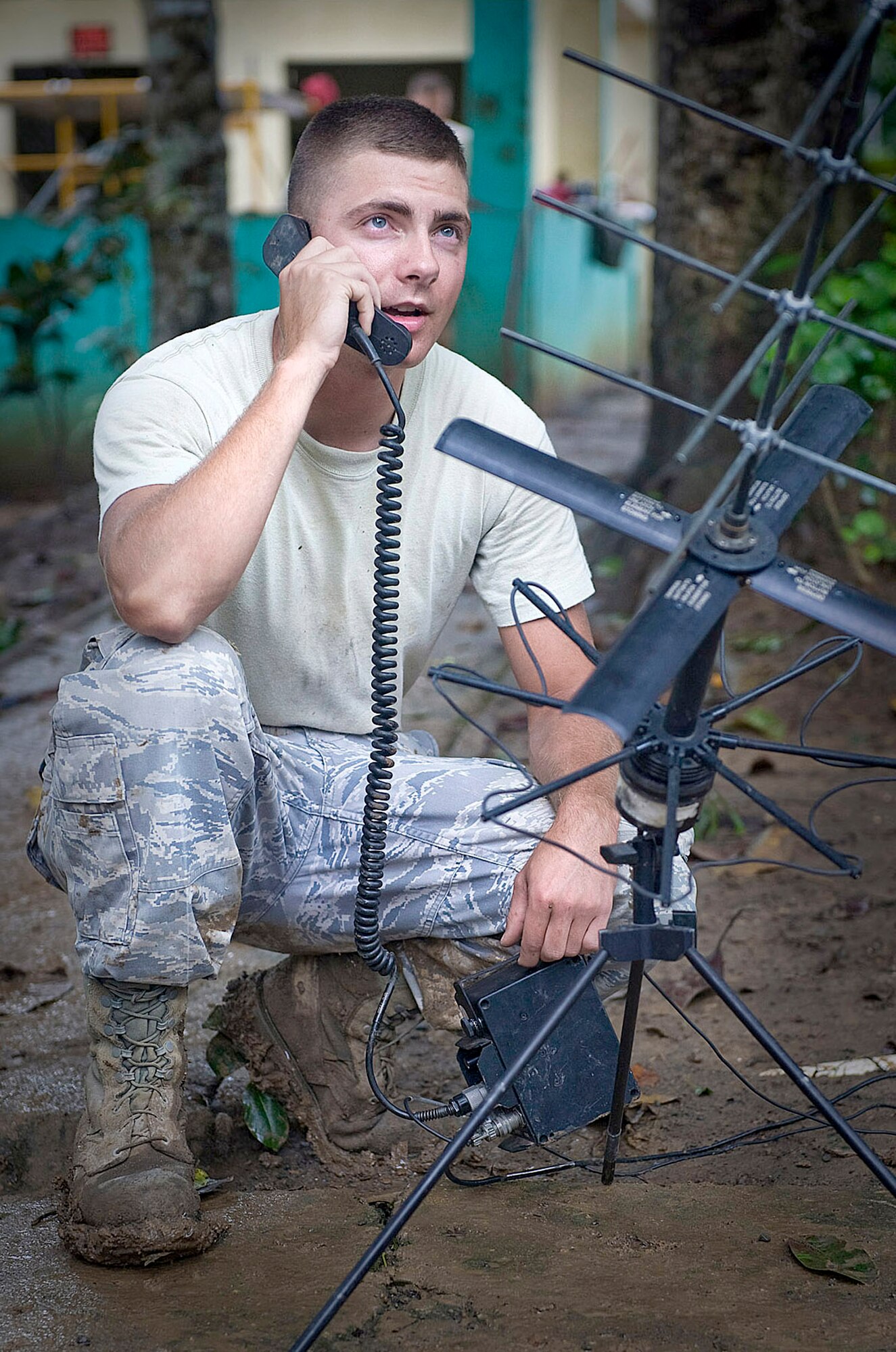 Airman 1st Class Jeffery Westmoreland radios personnel movements to the tactical operations center July 28, 2010, during Exercise New Horizons Panama 2010. Airman Westmoreland is deployed from the 32nd Combat Communications Squadron. (U.S. Air Force photo/Tech. Sgt. Sean Worrell)