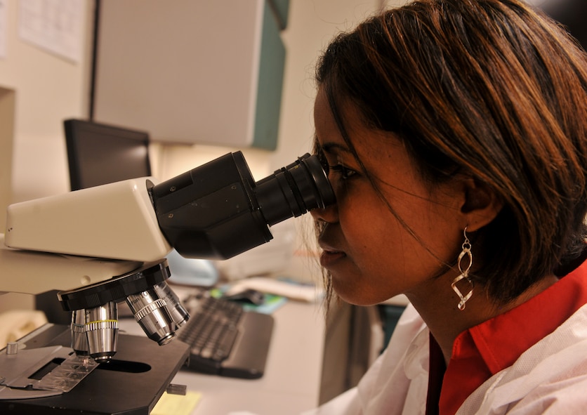 MOODY AIR FORCE BASE, Ga. -- Rose Finch, 23rd Medical Group medical laboratory technician, looks through a microscope and counts red and white blood cells Aug. 1. A certain number of red and white blood cells determine whether or not there is an infection. The lab's ability to correctly determine the presence of an infection was one of the inspected areas during a major, recent inspection. This two-day inspection was conducted by the College of American Pathologists and the 23rd Medical Group scored the highest possible rating of "outstanding.”  (U.S. Air Force photo/Airman 1st Class Joshua Green)