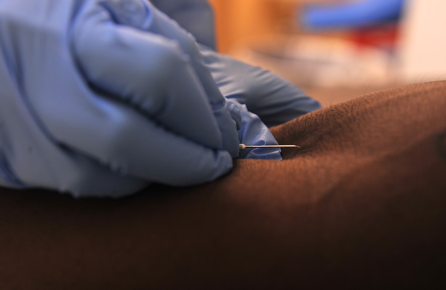 MOODY AIR FORCE BASE, Ga. -- Senior Airman Maria Exiga, 23rd Medical Group laboratory technician, prepares to inject a needle into the arm of Senior Airman Ricardo Taylor, 23rd Civil Engineer Squadron pest management journeyman, during a routine blood draw Aug. 1. The medical lab's clients include approximately 20,000 retirees, dependents and civilians, as well as active-duty military. (U.S. Air Force photo/Airman 1st Class Joshua Green)