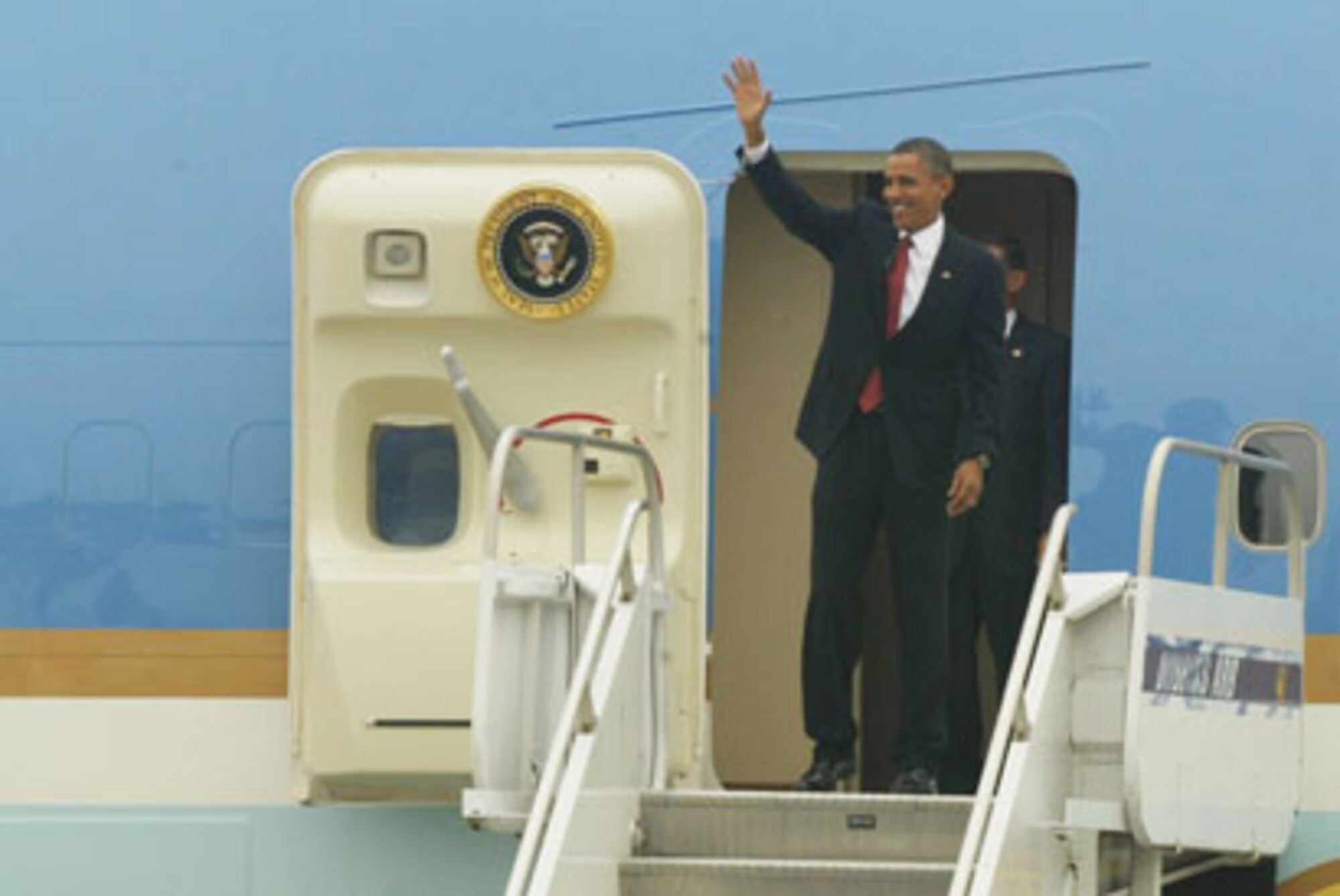 President Barack Obama waves from Air Force One at Dobbins Air Reserve Base, Ga., Aug. 2 prior to attending a convention and political fundraiser in Atlanta. (U.S. Air Force photo/Don Peek)