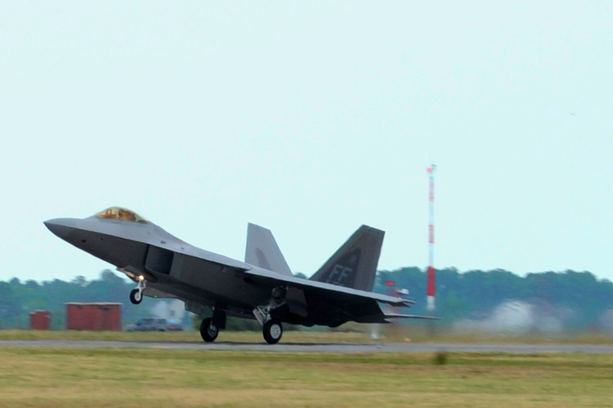 LANGLEY AIR FORCE BASE, Va. – Col. Matt Molloy, 1st Fighter Wing commander, brings home the newest 1st FW F-22 Raptor Flag Ship July 27.  The fifth generation fighter has been updated to carry a larger payload, has a more advanced radar system and has been modified so it will be easier to maintain. (U.S. Air Force photo/Staff Sgt. Tabitha Kuykendall) (Released)

