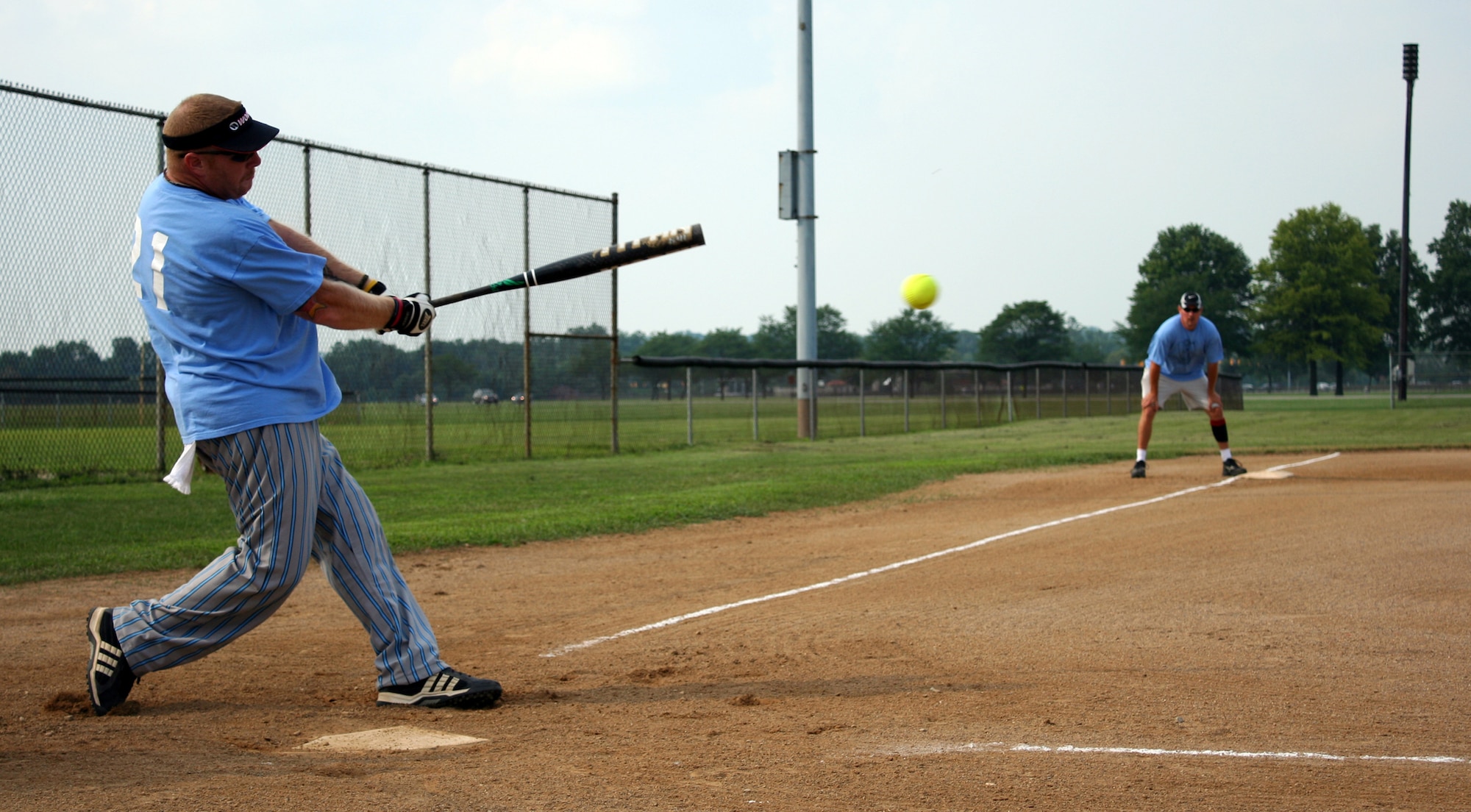 WRIGHT-PATTERSON AIR FORCE BASE, Ohio – Tech. Sgt. Brian Knouse, 445th Operations Support Squadron, smacks one into left field for the 445th Airlift Wing softball team against the Sierra Deltas July 15.  The Sierra Deltas won 22-9; this was the 445th Airlift Wing team‘s first loss of the season. (U.S. Air Force photo/Tech. Sgt. Jeremy Caskey)