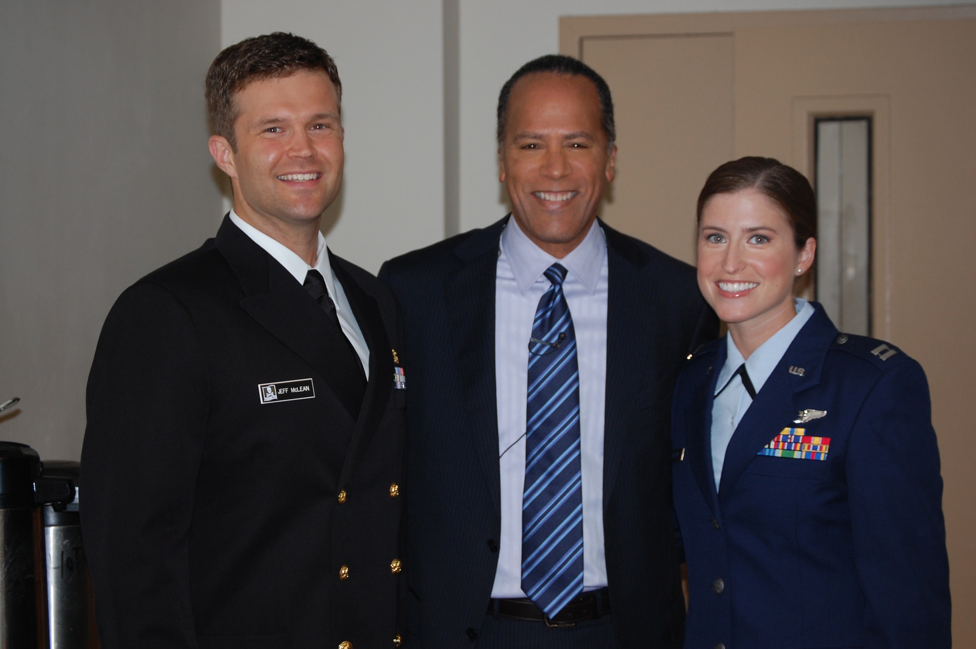 Navy Lt. Jeff McLean (left), NBC Today weekend anchor Lester Holt, and 911th Air Refueling Squadron Capt. Christine McLean pose for the camera. (USAF photo by Maj. Shannon Mann, 916ARW/PA)