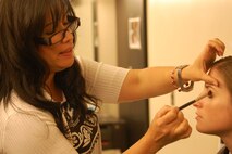 It's all about the perks when you're a big celebrity! Capt. Christine McLean has her makeup professionally done prior to her interview on NBC's Today. (USAF photo by Maj. Shannon Mann, 916ARW/PA)