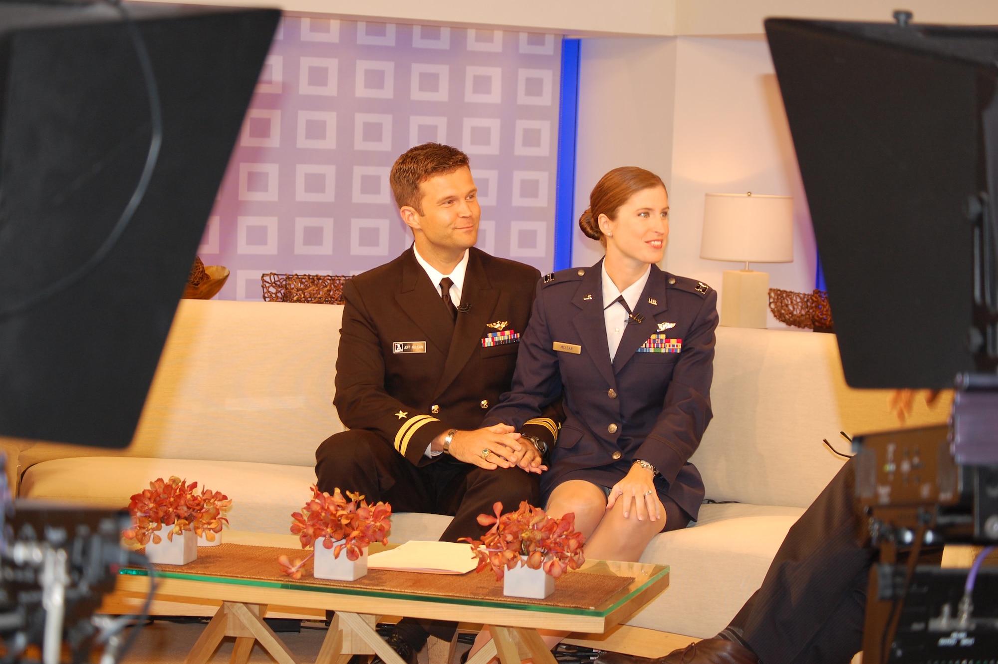 Navy Lt. Jeff McLean and wife, Air Force Capt. Christine McLean are framed by the Today cameras during their in-studio interview on Sunday, Aug. 1. (USAF photo by Maj. Shannon Mann, 916ARW/PA)