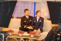 Navy Lt. Jeff McLean and wife, Air Force Capt. Christine McLean are framed by the Today cameras during their in-studio interview on Sunday, Aug. 1. (USAF photo by Maj. Shannon Mann, 916ARW/PA)