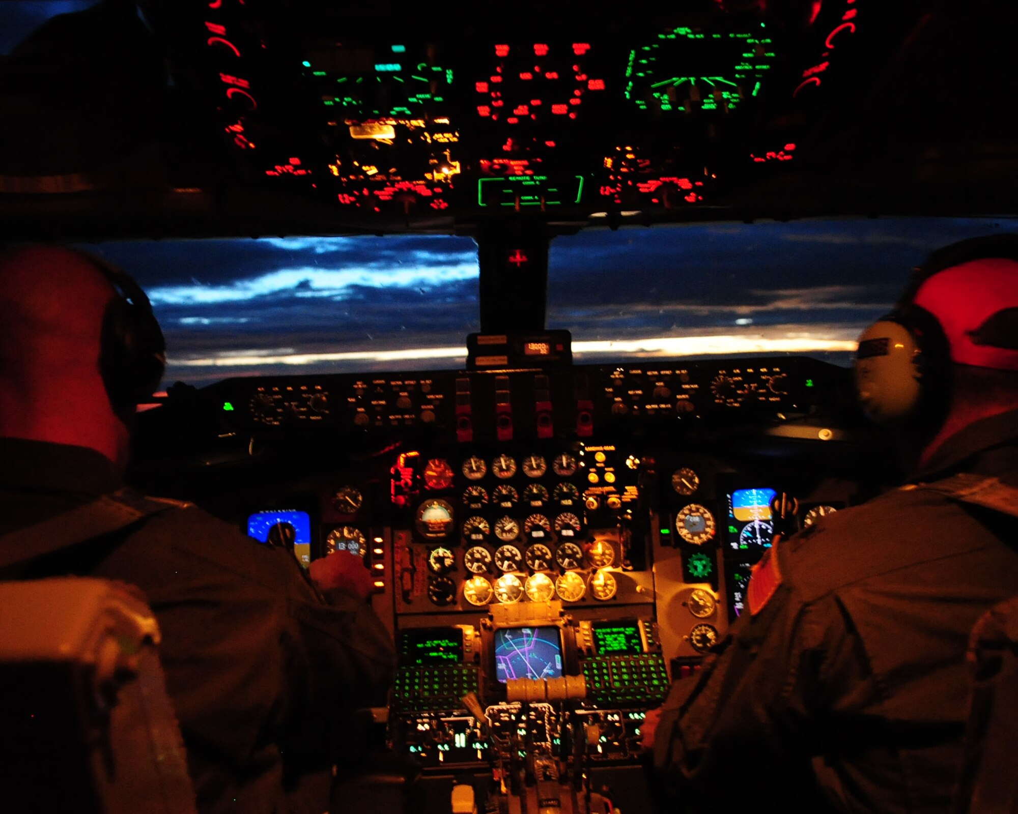 Capt. Jim Moretti (left) and Lt. Col. Chuck Tubbs, pilots from the 171st Air Refueling Wing based out of Pittsburgh International Airport, Penn., fly the KC-135 Stratotanker during an aerial refueling mission in Southern Arizona July 22, to support pilots from the 355th Fighter Wing. The crew and KC-135 supported refueling missions throughout the week so students enrolled in the A-10C Pilot Initial Qualification Course could accomplish their night refueling training. (U.S. Air Force photo/Airman Jerilyn Quintanilla)