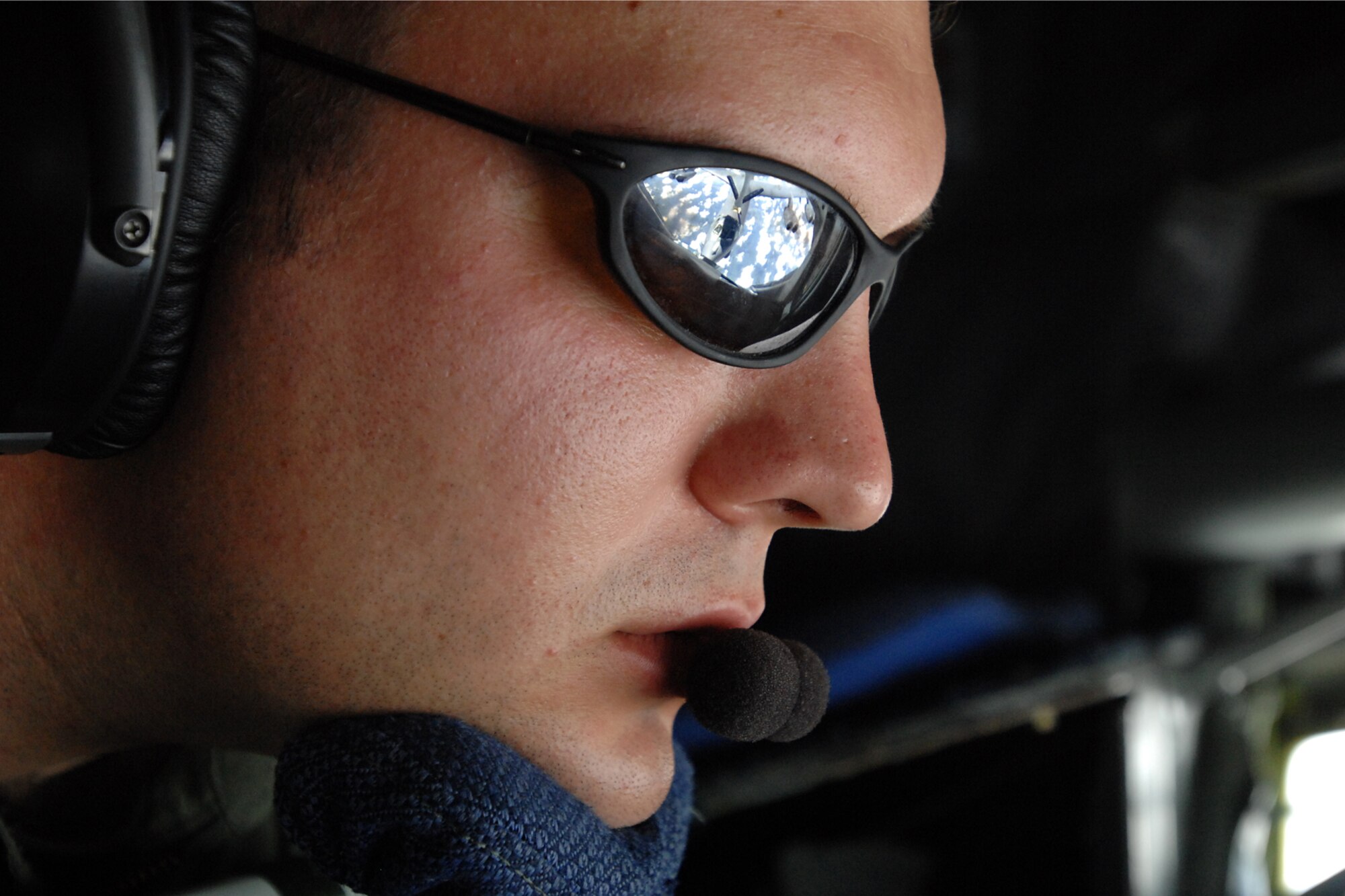 GRISSOM AIR RESERVE BASE, Ind. -- The reflection of a B-52 Stratofortress can be seen in the glasses of Staff Sgt. Brandon Toth, an inflight refueling technician with the 74th Air Refueling Squadron, as he refuels the aircraft during a recent mission. (U.S. Air Force photo)