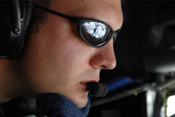 GRISSOM AIR RESERVE BASE, Ind. -- The reflection of a B-52 Stratofortress can be seen in the glasses of Staff Sgt. Brandon Toth, an inflight refueling technician with the 74th Air Refueling Squadron, as he refuels the aircraft during a recent mission. (U.S. Air Force photo)